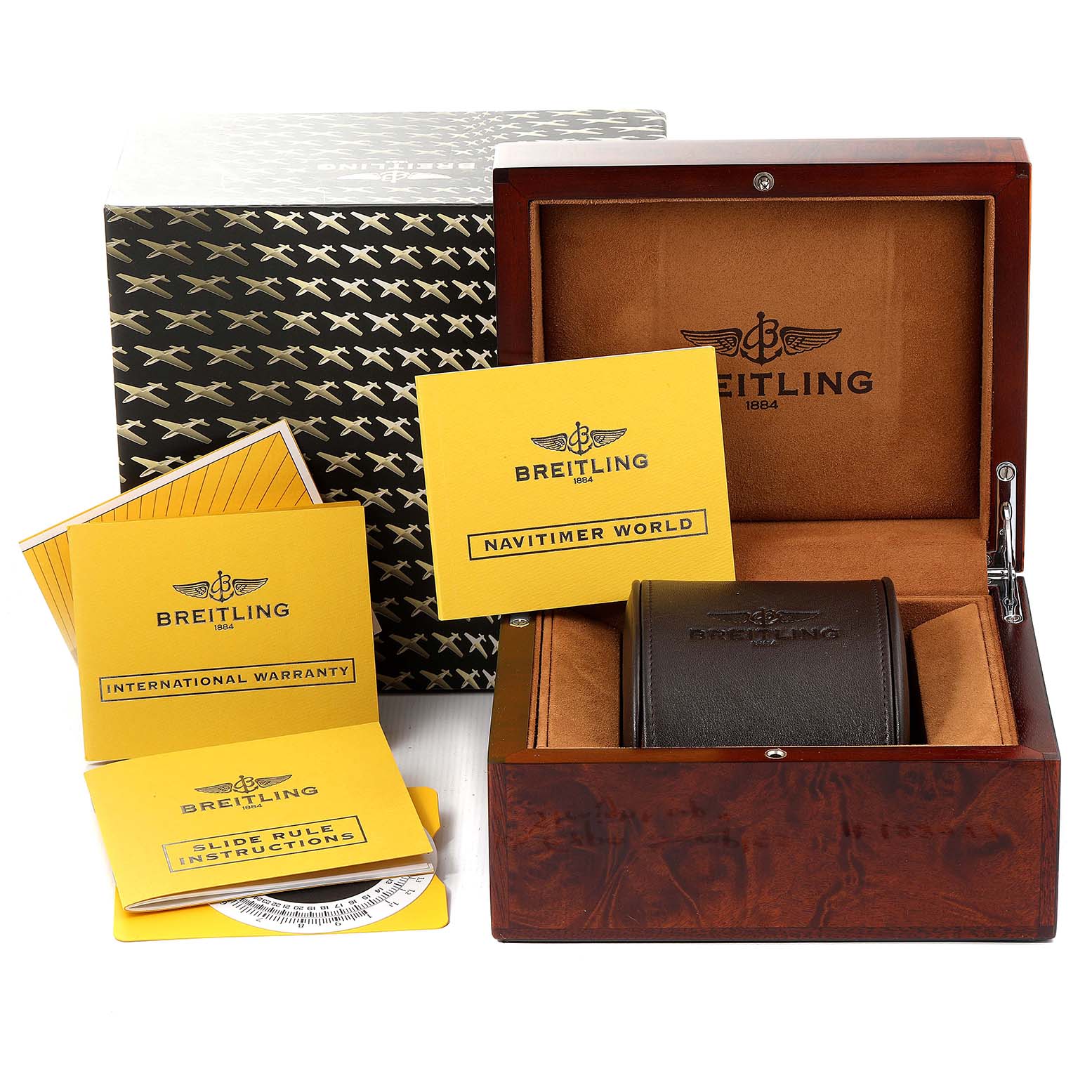 The image shows the packaging and accessories for the Breitling Navitimer H24322 Men
s Rose Gold Black Dial H24322 Men
s Rose Gold Black Dial model, including the box, manual, and warranty cards.