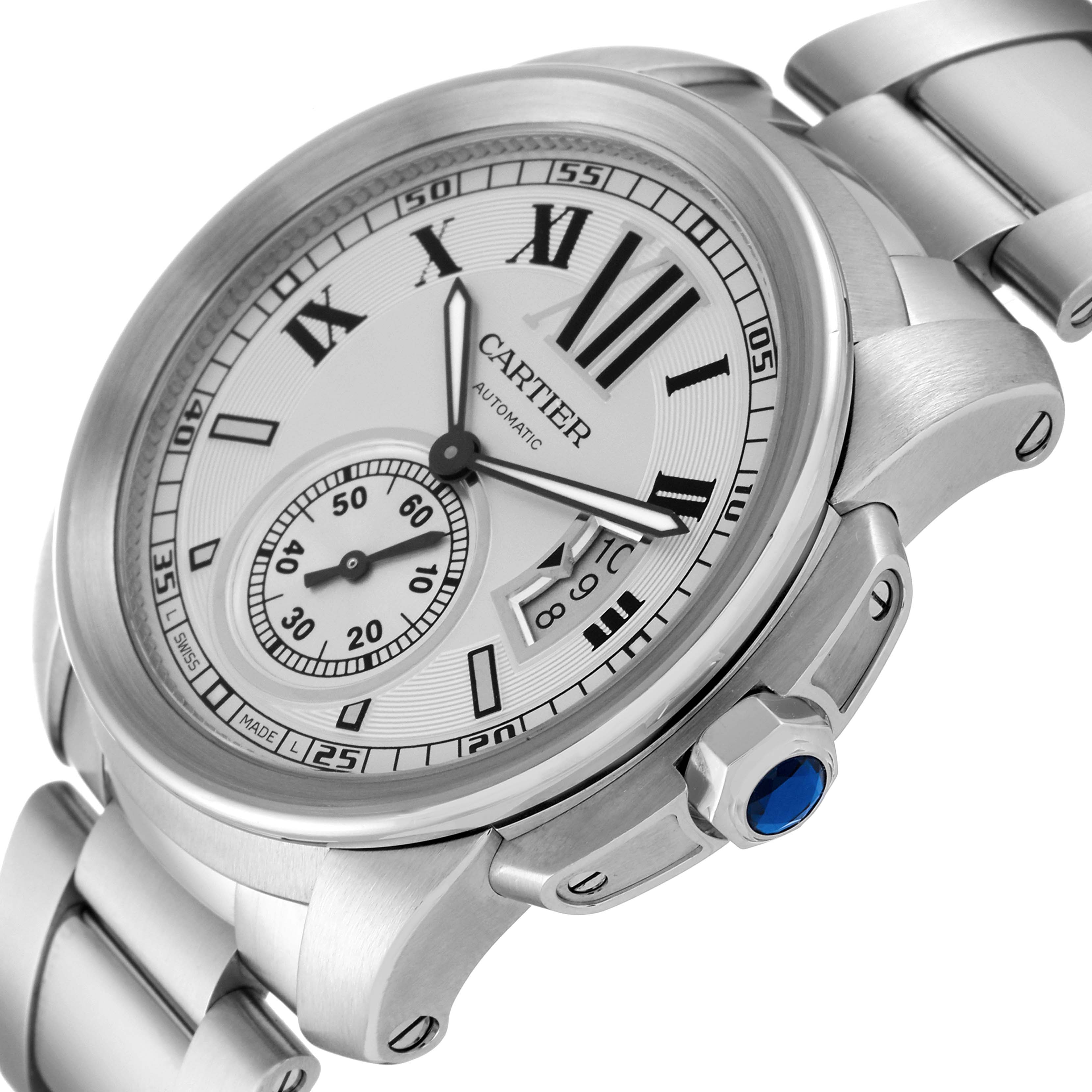 The image shows a close-up, angled view of the face, bezel, and part of the bracelet of the Calibre de Cartier watch by Cartier.