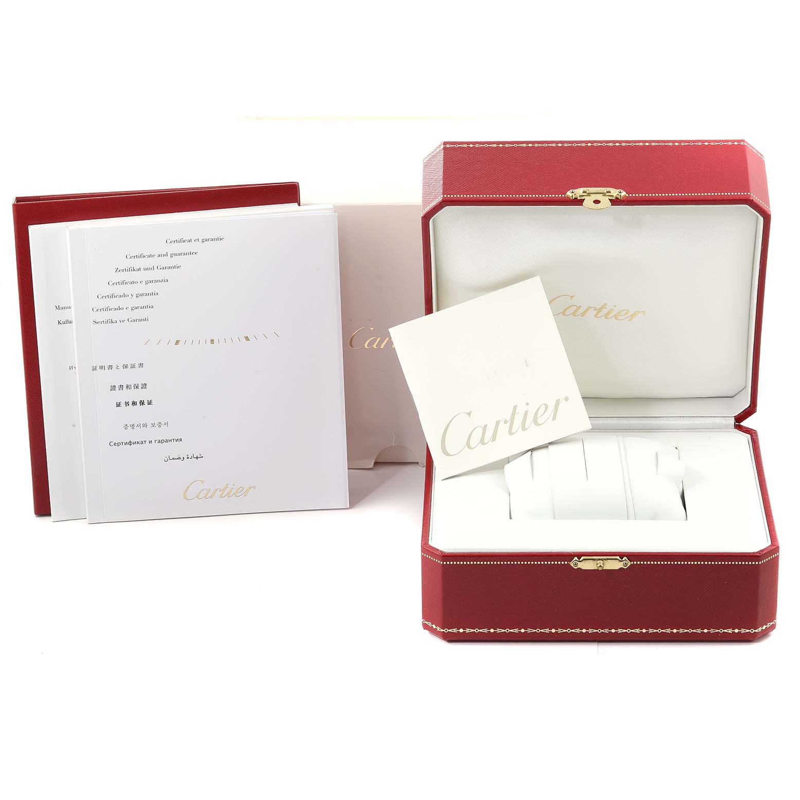 This image shows the packaging and booklet for the Calibre de Cartier watch by Cartier, including the red watch box and papers.