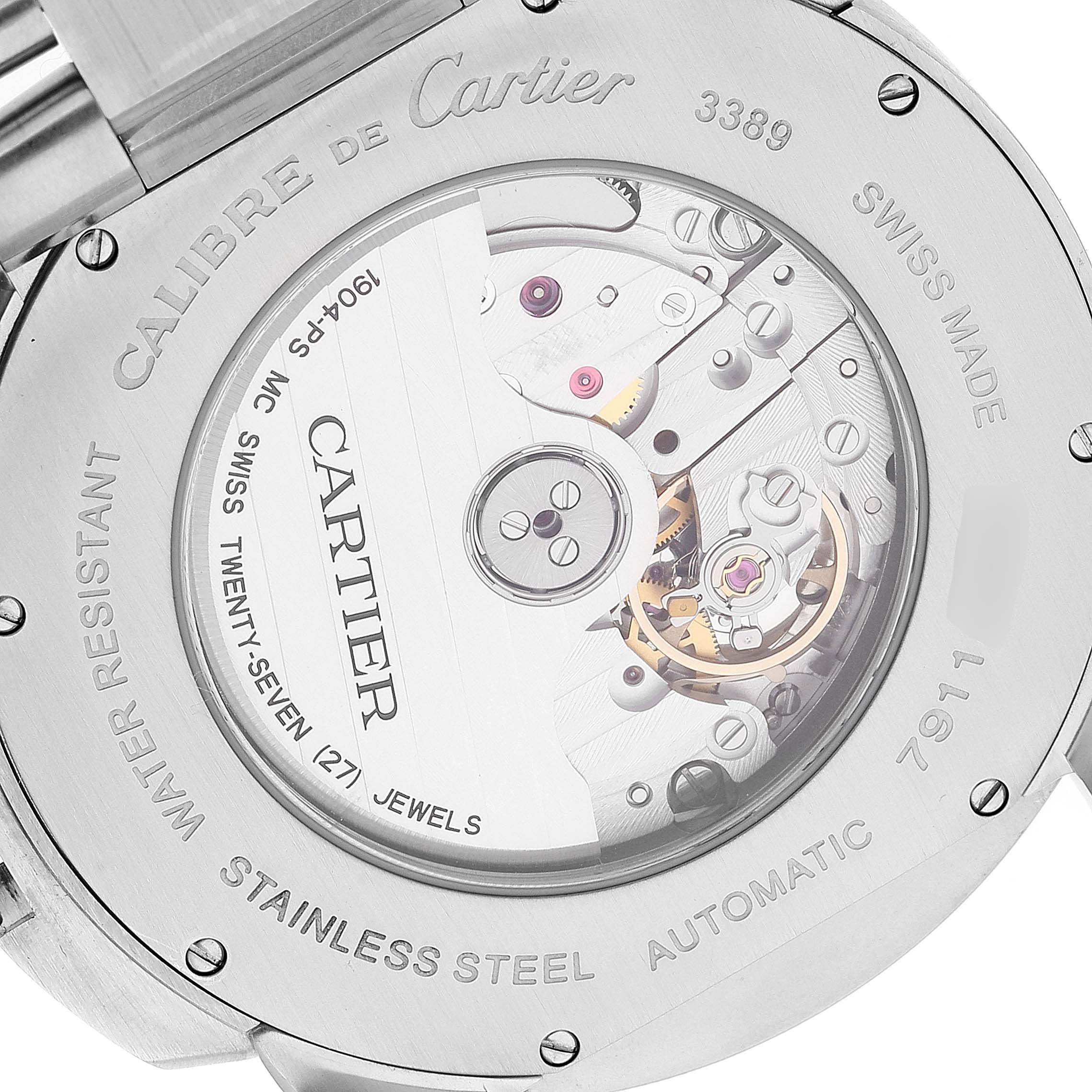 The image shows the back view of a Calibre de Cartier model by Cartier, displaying the mechanical movement and engravings.