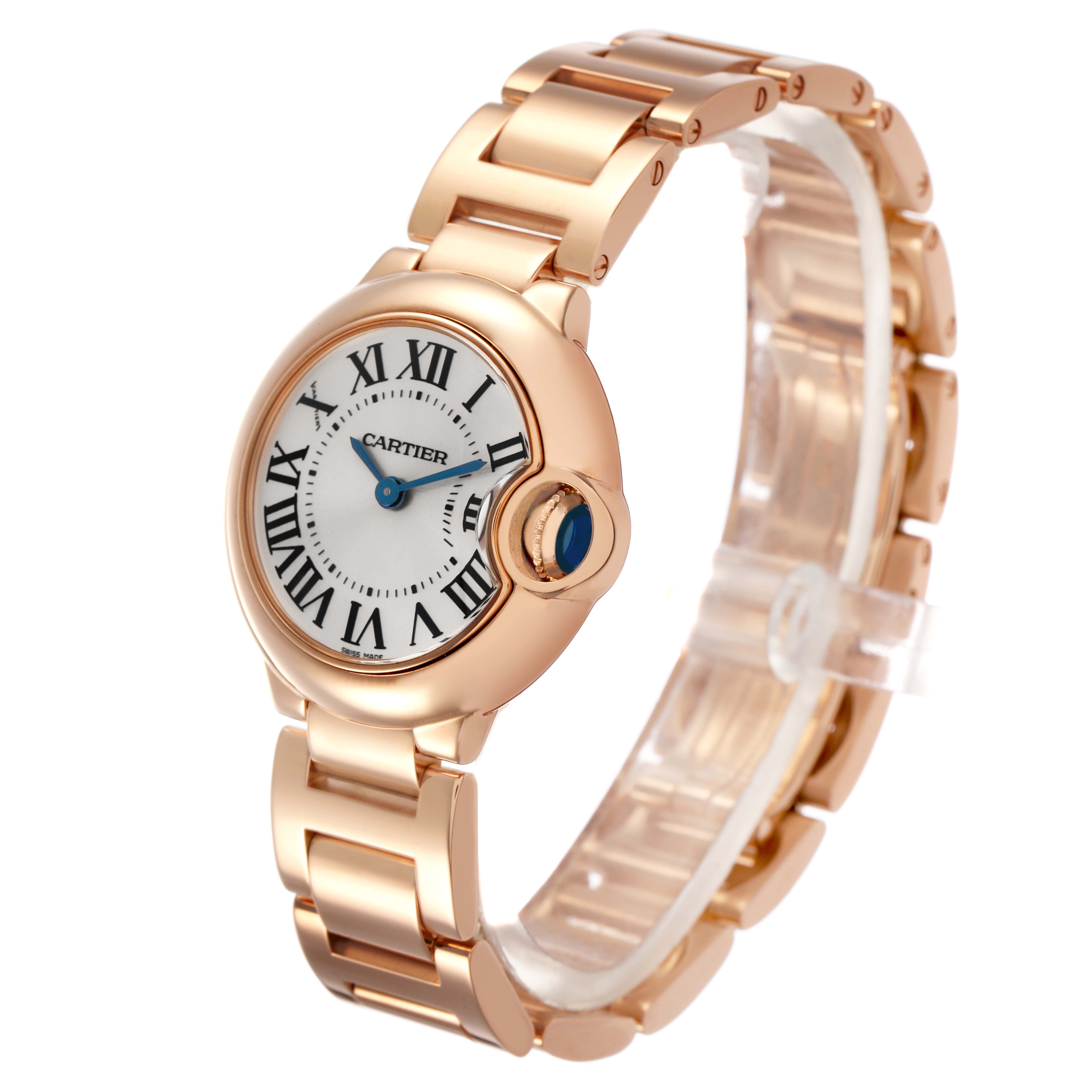 The Ballon Bleu by Cartier is shown at a three-quarter angle, highlighting its round case, Roman numeral dial, and bracelet.
