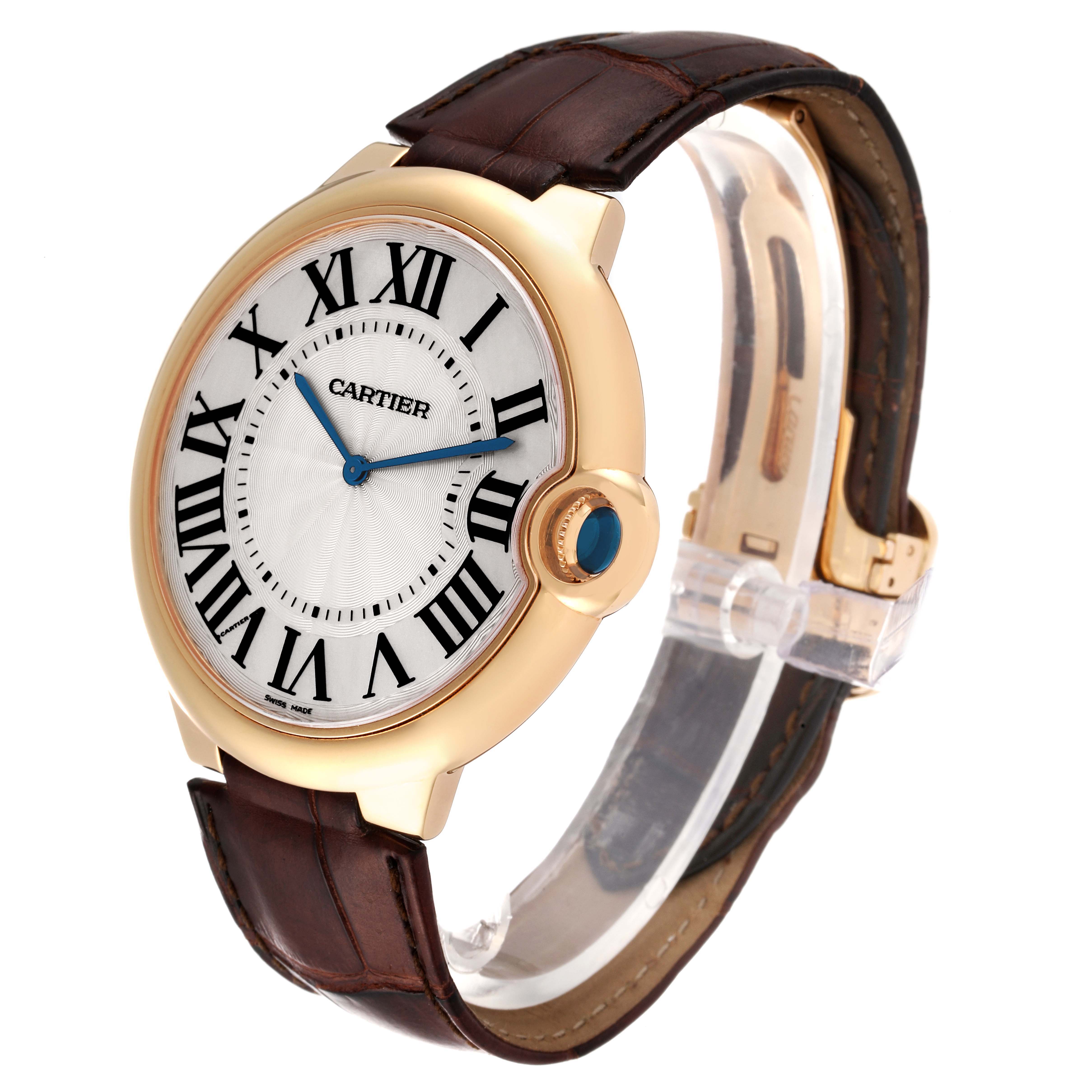 The Cartier Ballon Bleu W690054 Men's Yellow Gold Silver Dial W690054 Men's Yellow Gold Silver Dial watch is shown at a three-quarter angle, highlighting the face, case, and leather strap.