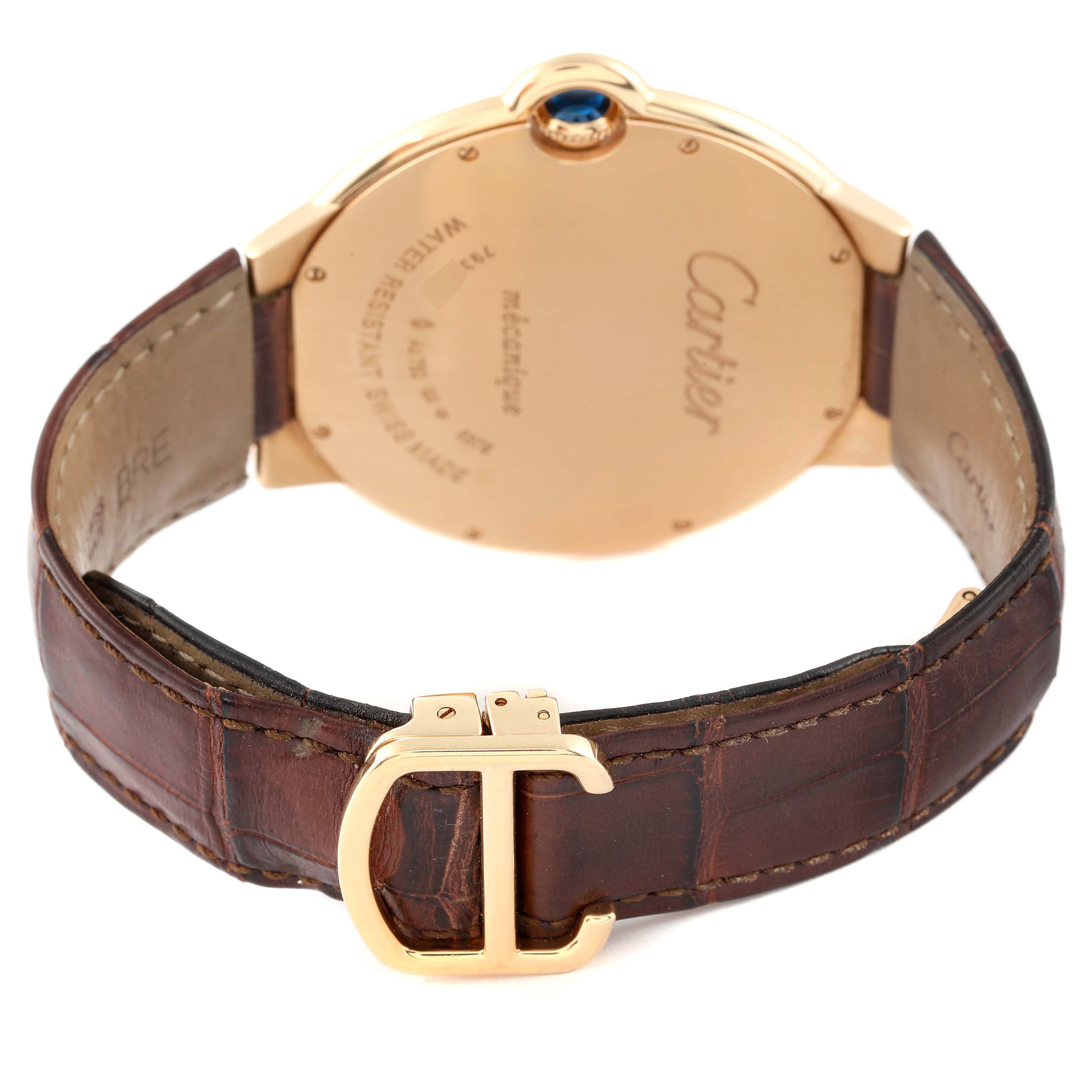 The image shows the back of the Cartier Ballon Bleu W690054 Men's Yellow Gold Silver Dial W690054 Men's Yellow Gold Silver Dial watch and its leather strap with a gold Cartier buckle.