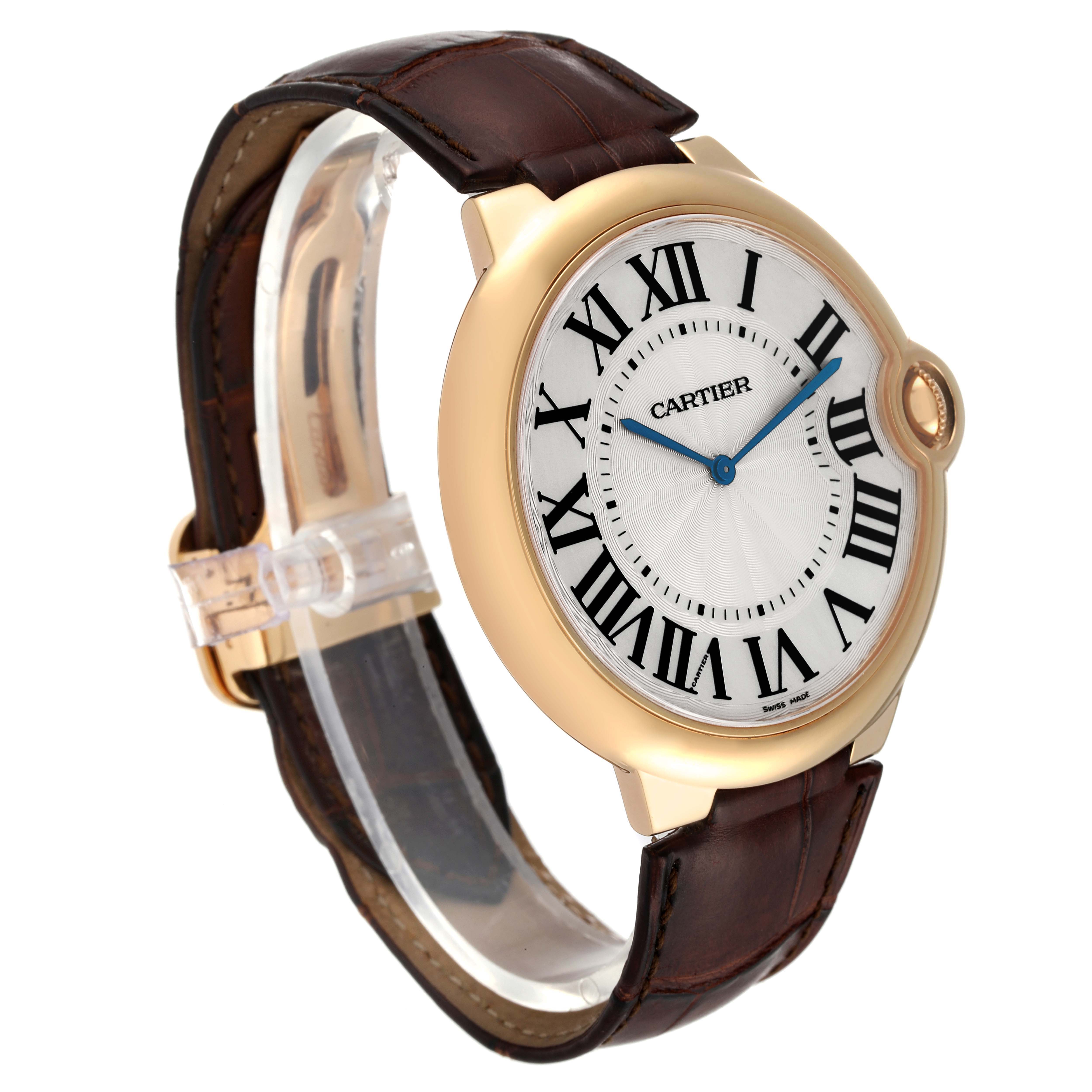 The Cartier Ballon Bleu W690054 Men's Yellow Gold Silver Dial W690054 Men's Yellow Gold Silver Dial watch is shown from a left side angle, highlighting its face, bezel, crown, and leather strap.