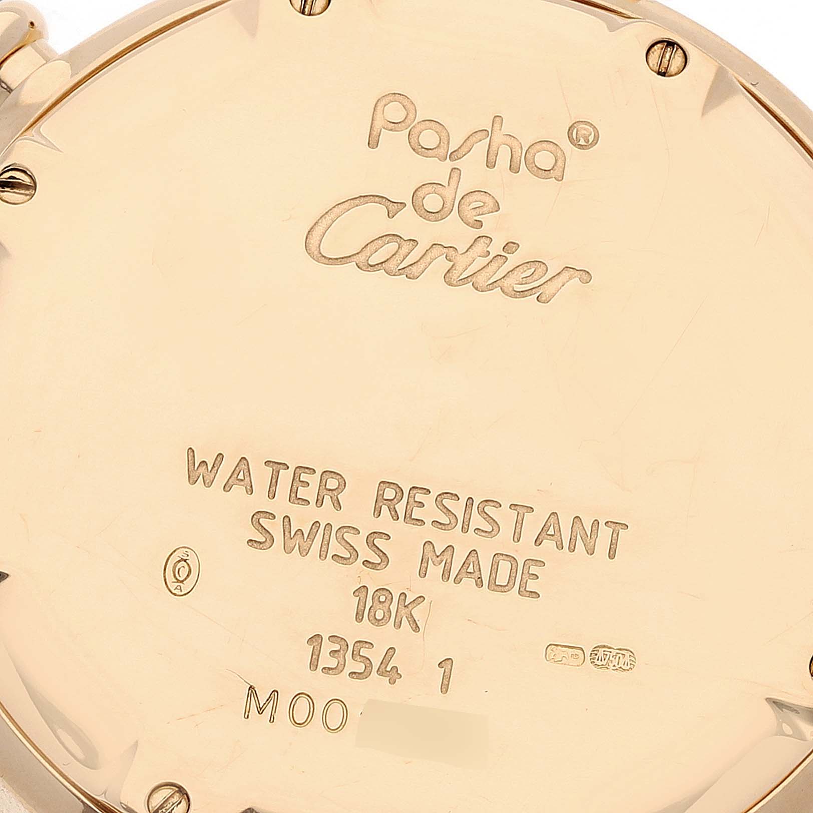 The image shows the back case of a Cartier Pasha 1354 Men's Yellow Gold Silver Dial 1354 Men's Yellow Gold Silver Dial watch, detailing its water resistance, material, and other engravings.