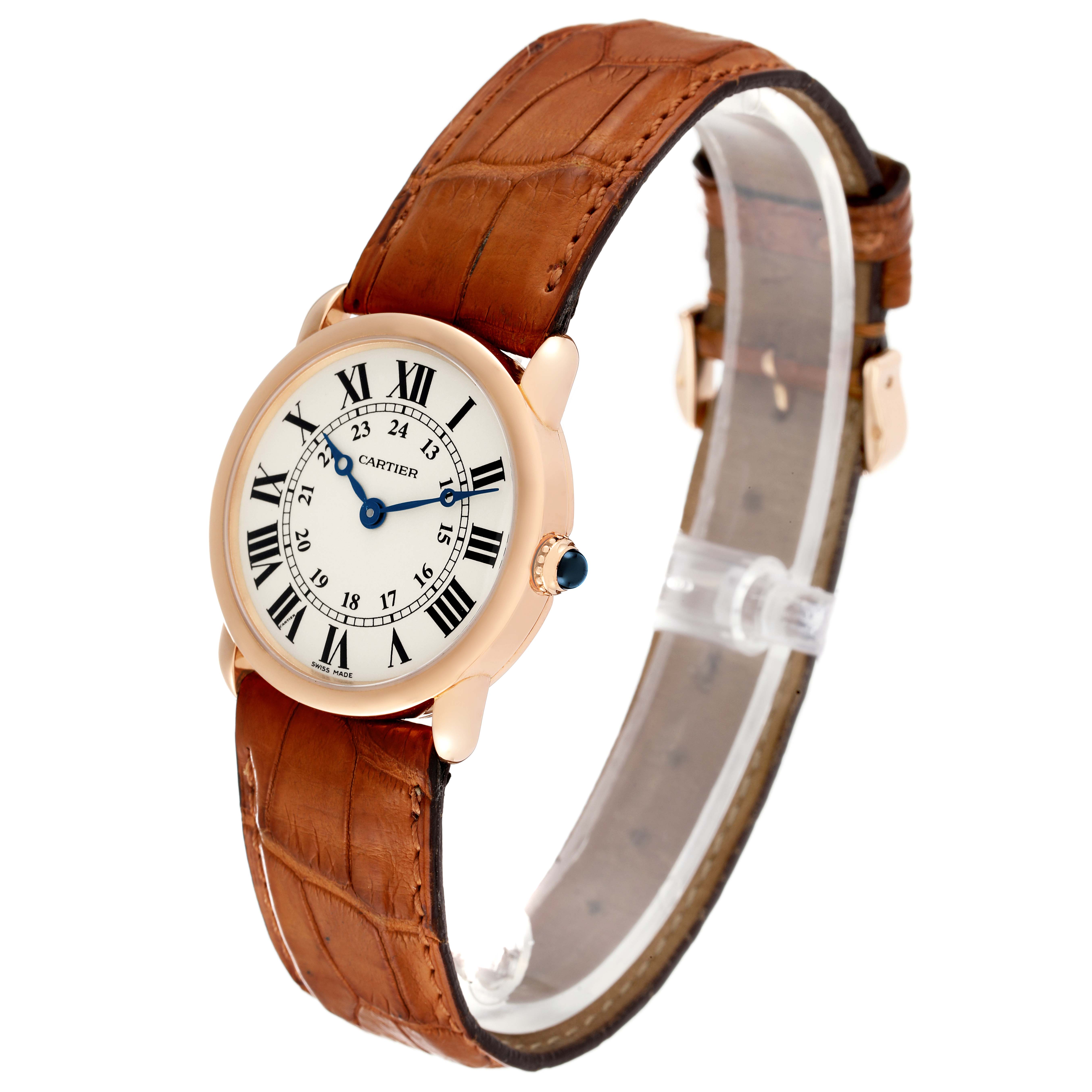 This image shows the Cartier Ronde W6800151 Women's Rose Gold Silver Dial W6800151 Women's Rose Gold Silver Dial watch at a slight angle, displaying its face, case, crown, and leather strap.