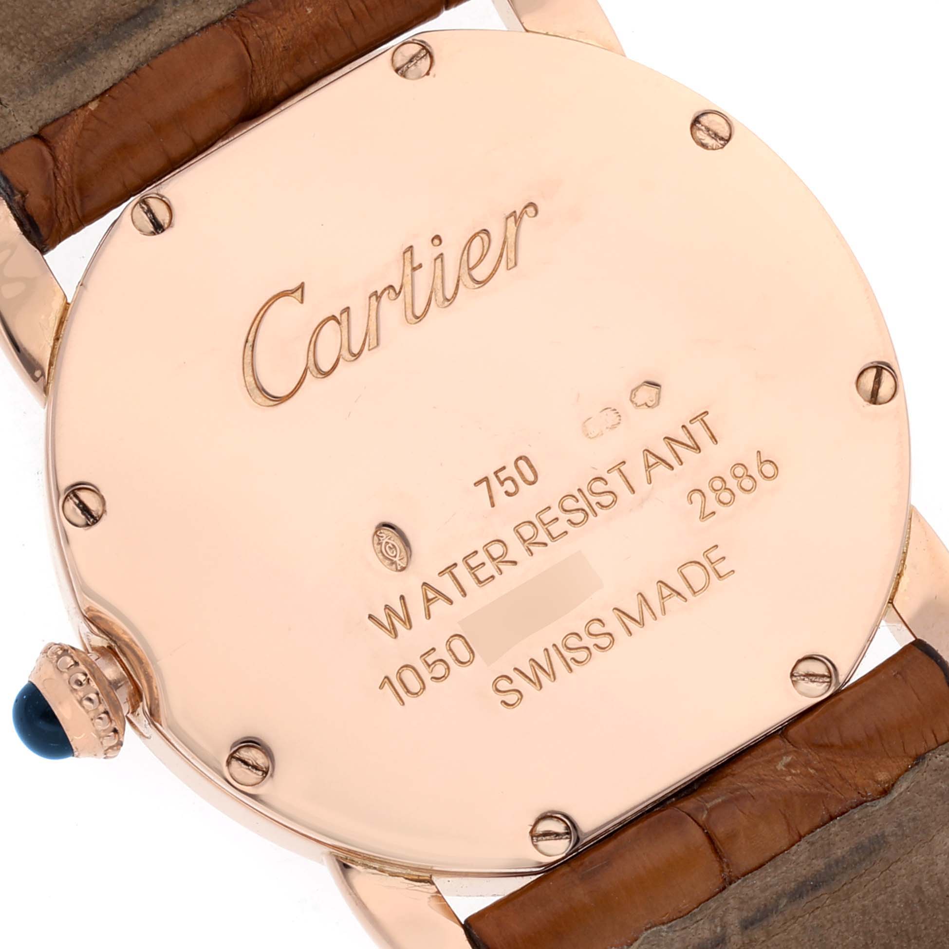The image shows the back case of a Cartier Ronde W6800151 Women's Rose Gold Silver Dial W6800151 Women's Rose Gold Silver Dial watch, highlighting engraved details and part of the leather strap.