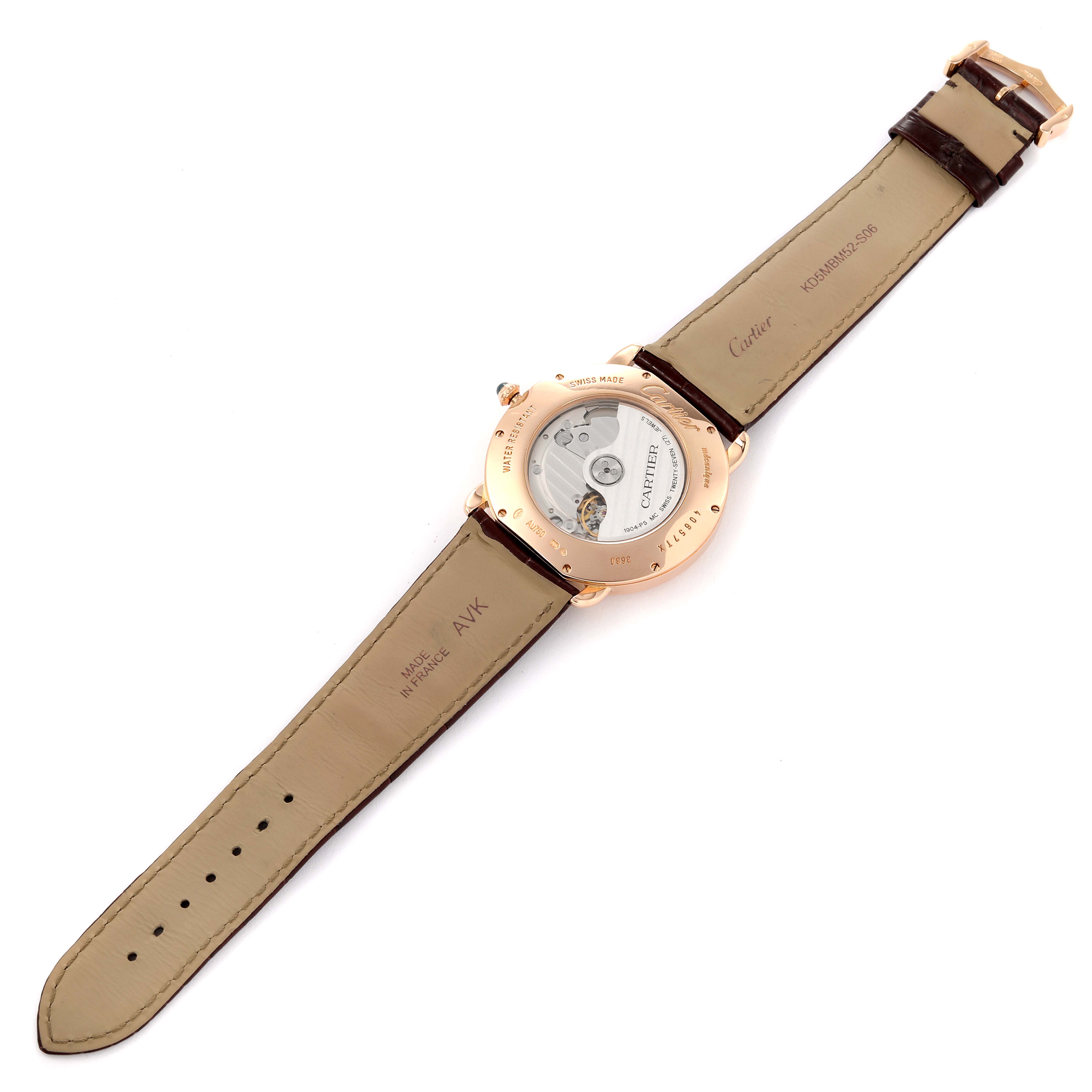 The image shows the backside of a Cartier Ronde W6801005 Men's Rose Gold Silver Dial W6801005 Men's Rose Gold Silver Dial watch, displaying its open case back and leather straps.