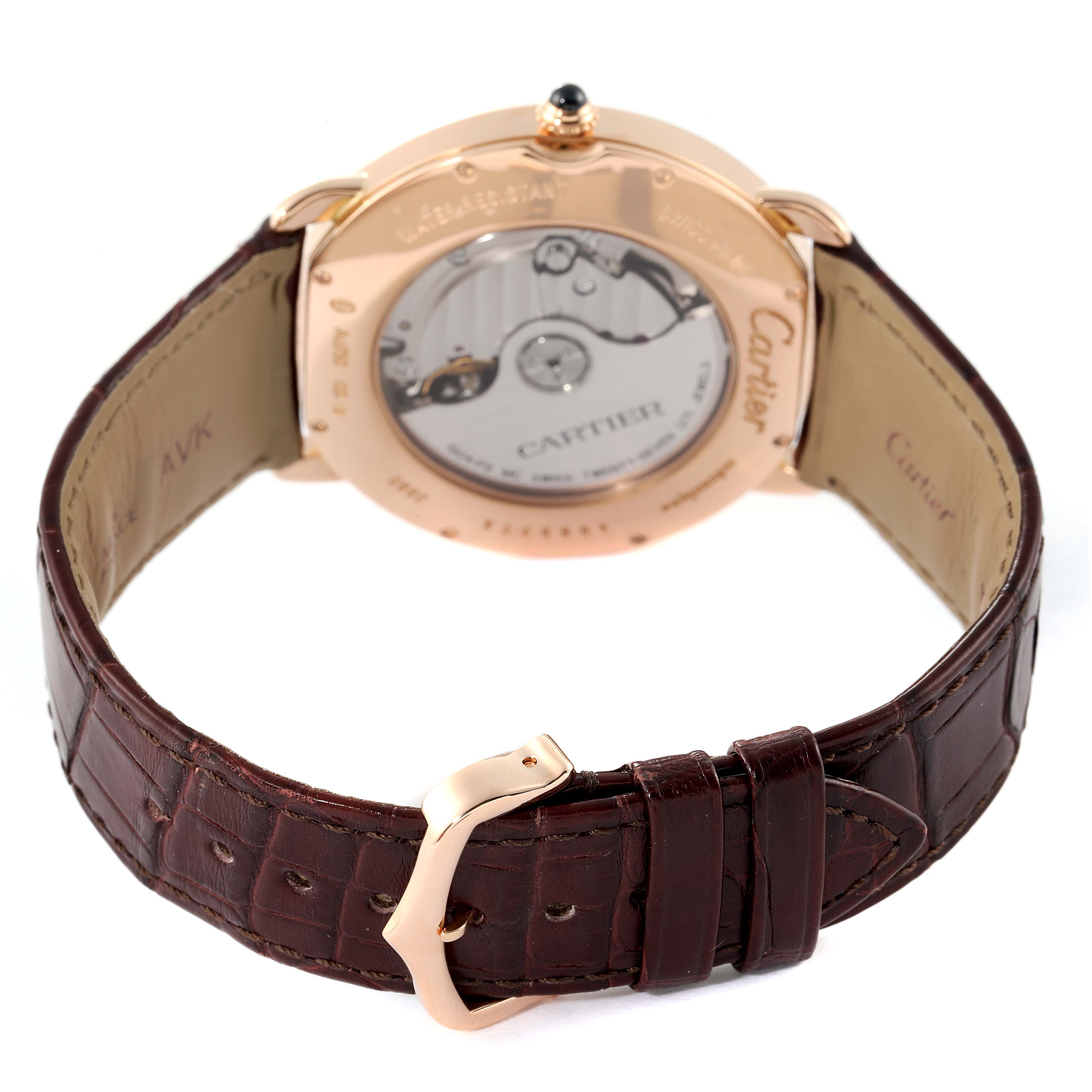 The image shows the back view of the Ronde model by Cartier, highlighting the exposed movement and brown leather strap.