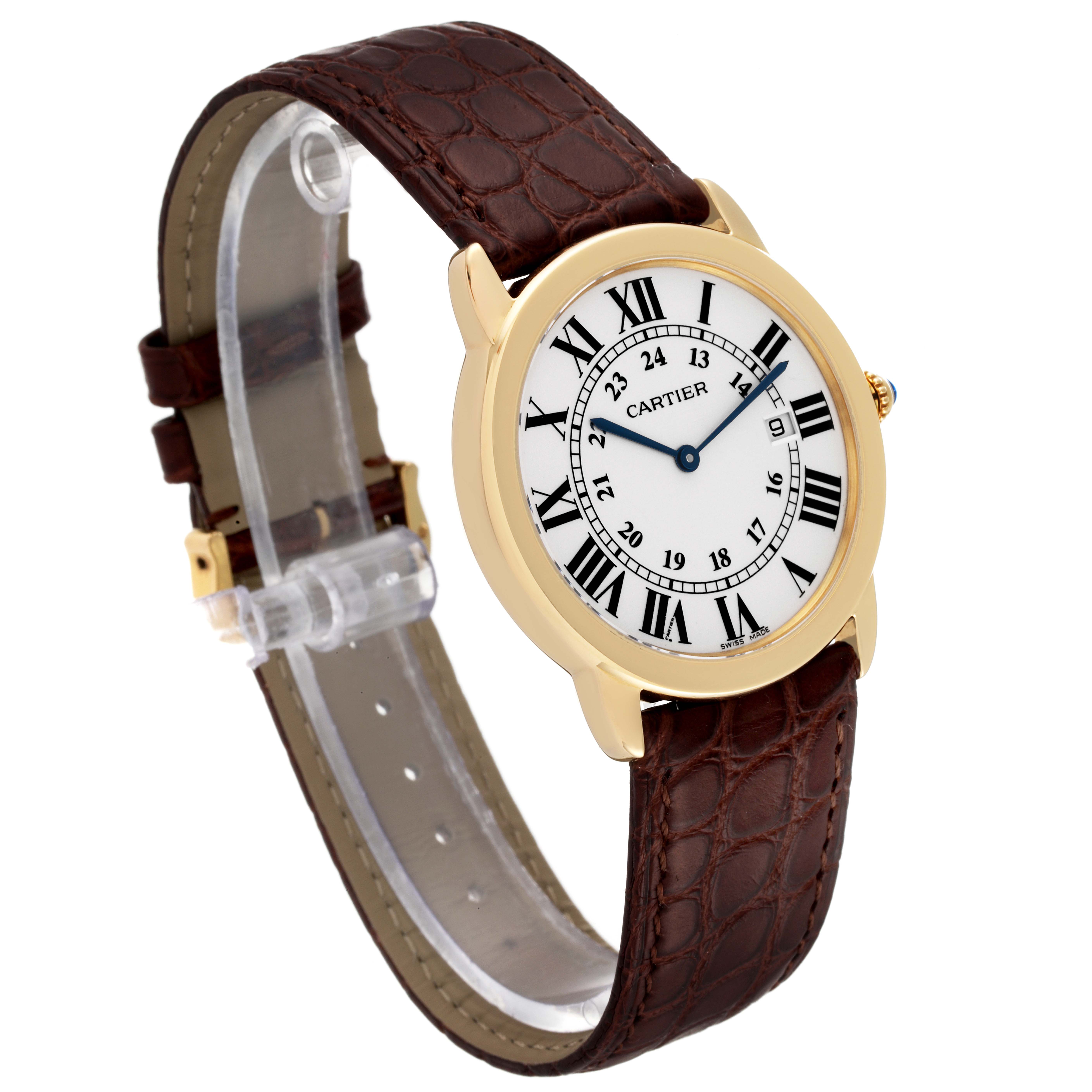 The image shows the Cartier Ronde W6700455 Men
s Yellow Gold Silver Dial W6700455 Men
s Yellow Gold Silver Dial model watch at an angled view displaying its face, a brown leather strap, and gold bezel.