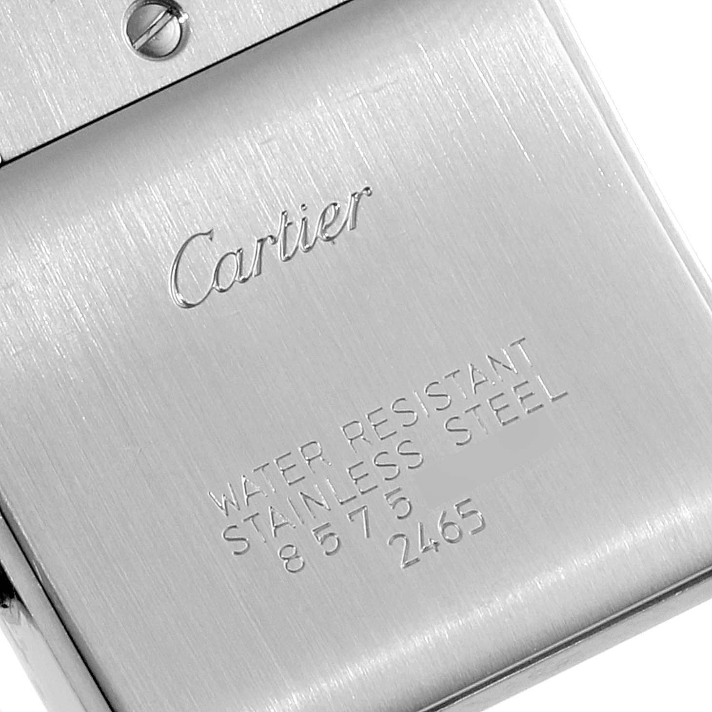 The image shows the back plate of a Cartier Tank Francaise W51011Q3 Women
s Stainless Steel Silver Dial W51011Q3 Women
s Stainless Steel Silver Dial watch, highlighting the engraved branding and material information.