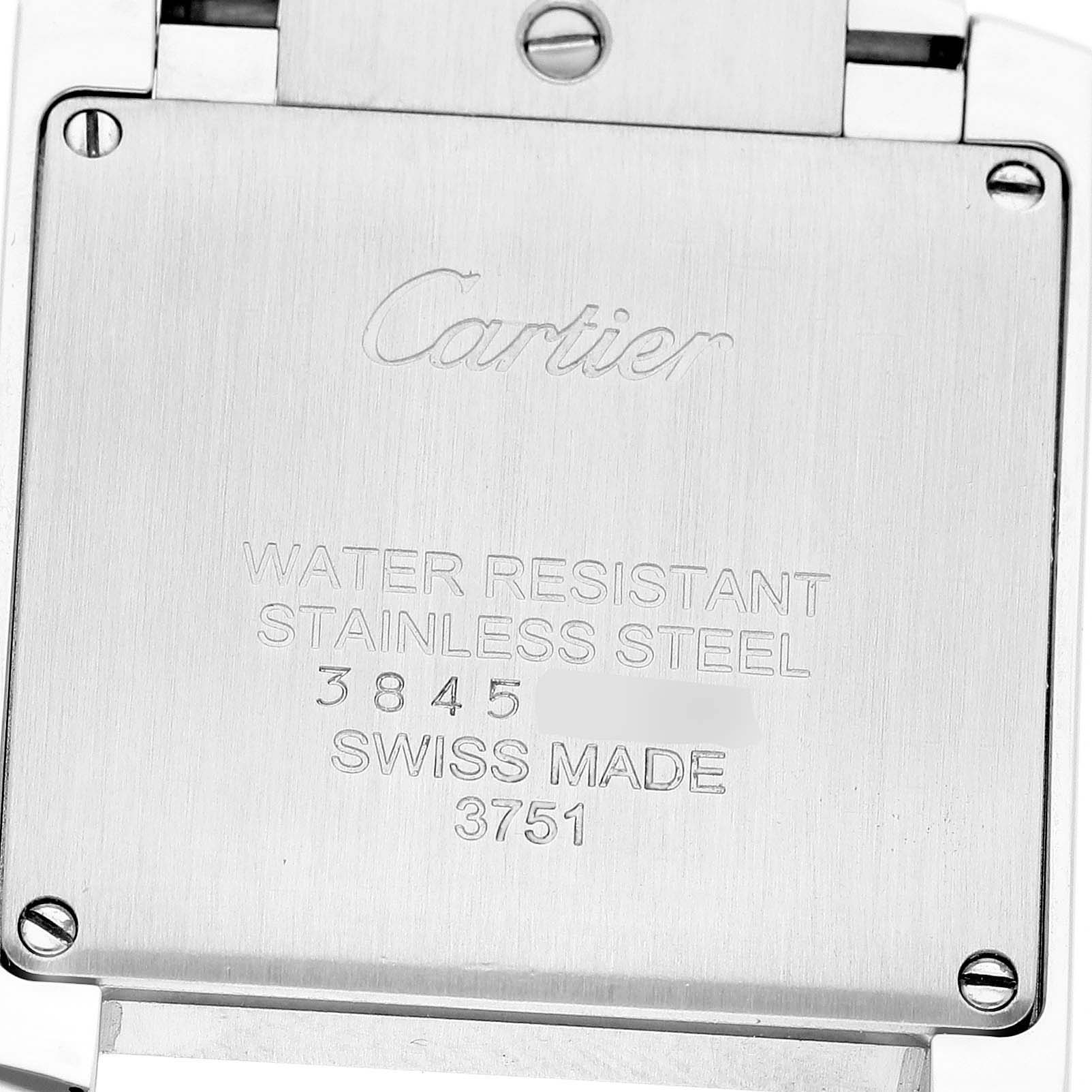 The image shows the back casing of a Cartier Tank Française watch, highlighting its stainless steel material and engraved details.