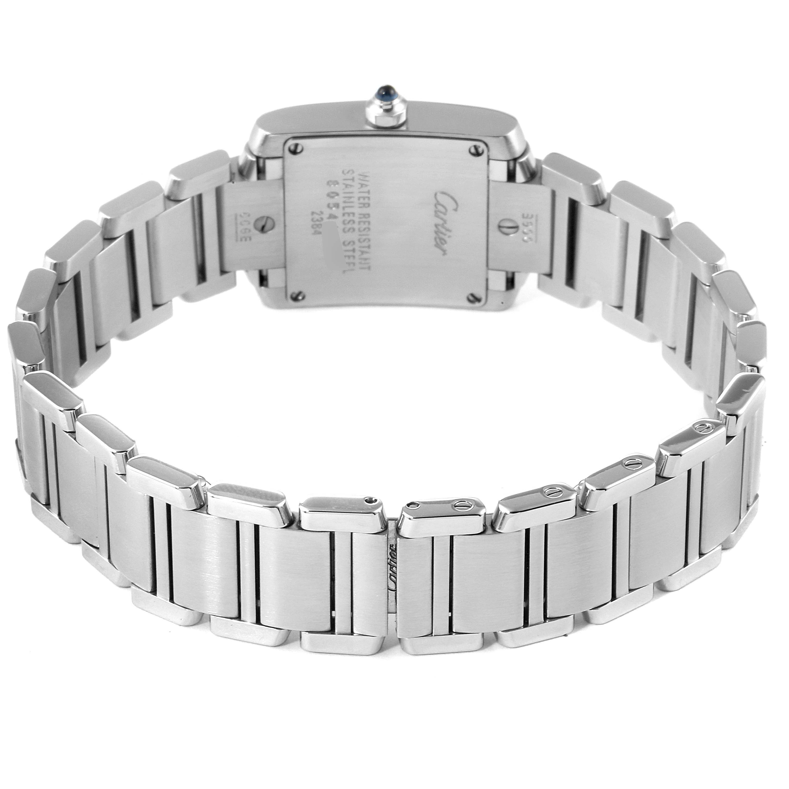 This image shows the back view of the Cartier Tank Française watch, highlighting its stainless steel bracelet and case back.