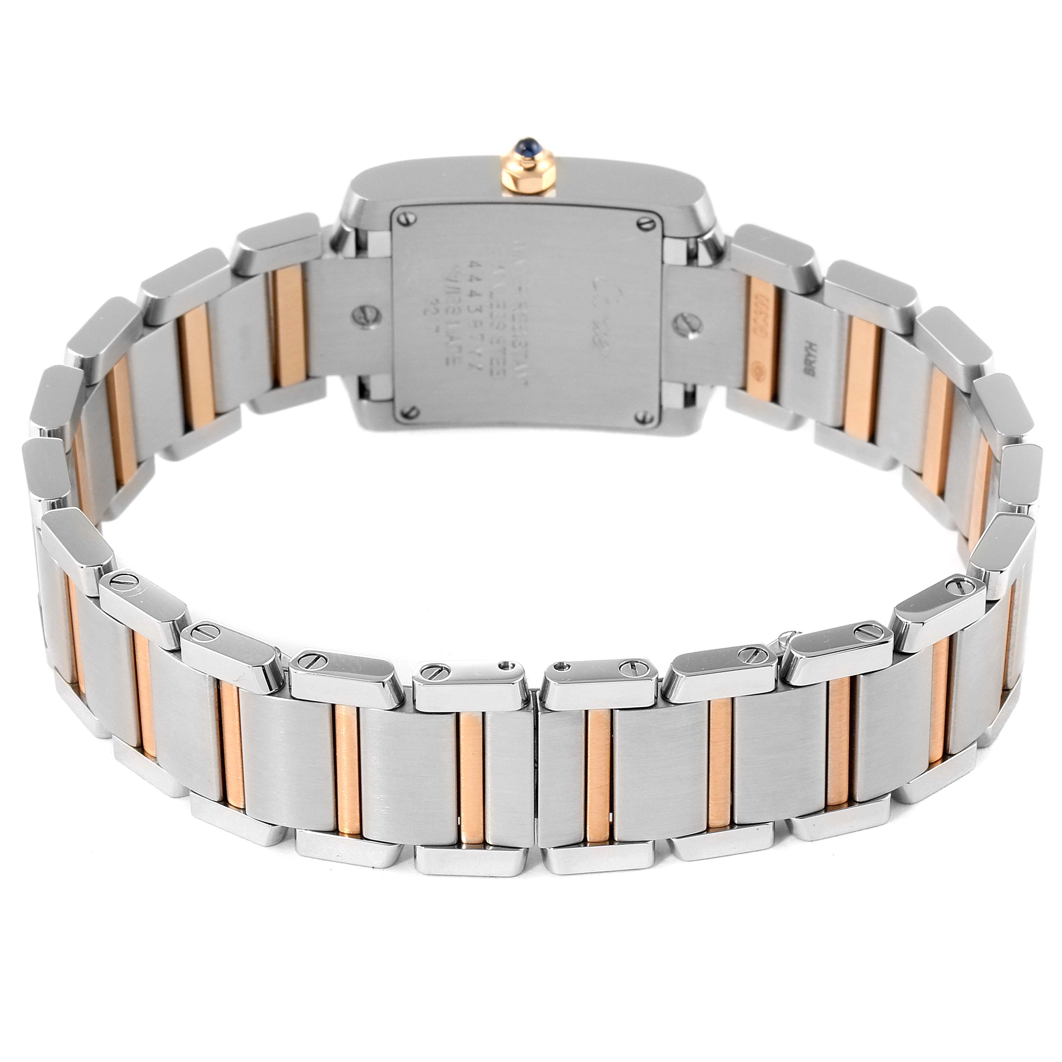 This image shows the back view of a Cartier Tank Francaise WE110004 Women's Steel and Gold (two tone) Silver Dial WE110004 Women's Steel and Gold (two tone) Silver Dial watch, displaying the metal bracelet and the case back.