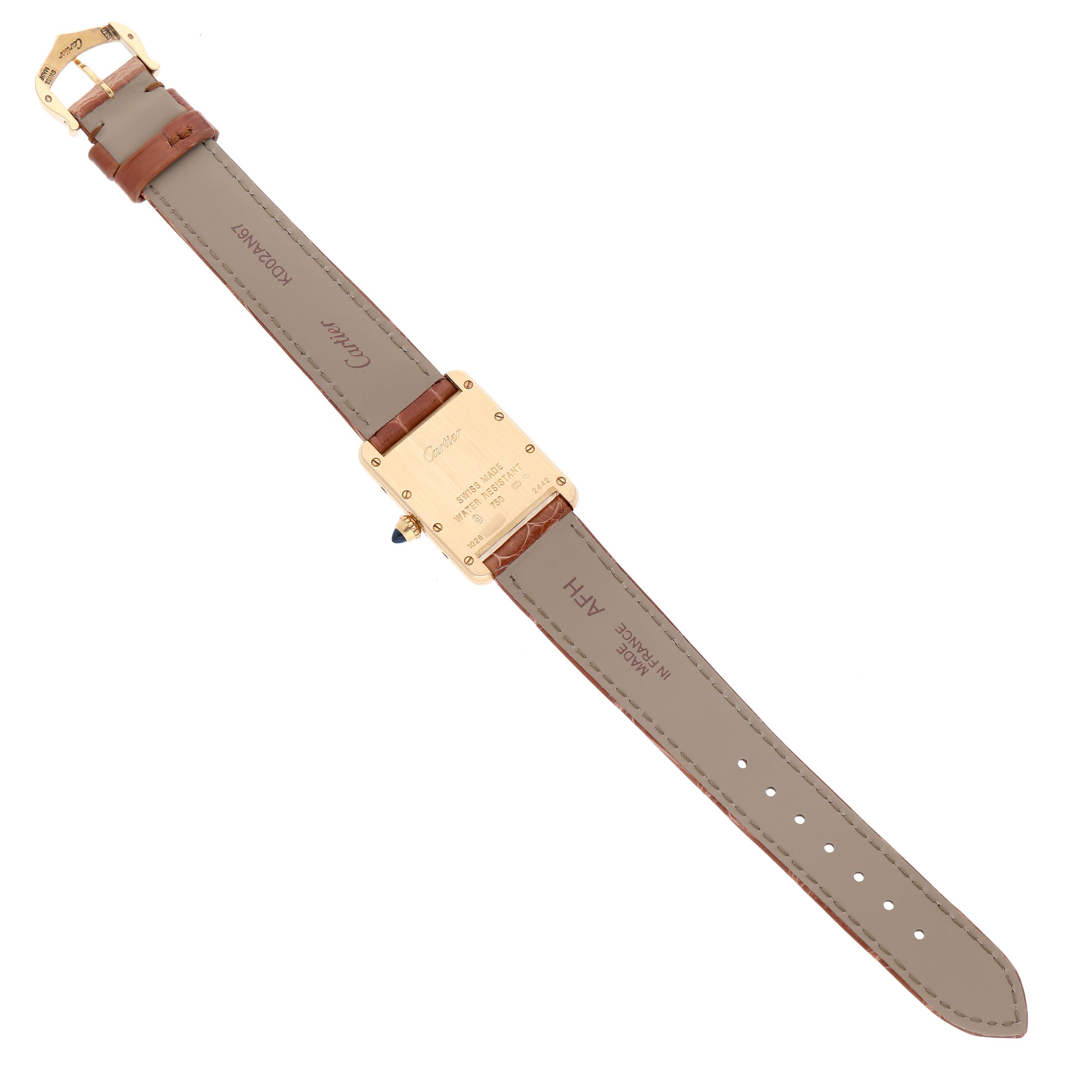 The image shows the back view of a Cartier Tank Louis W1529856 Women's Yellow Gold Silver Dial watch, highlighting its case, strap, and clasp.