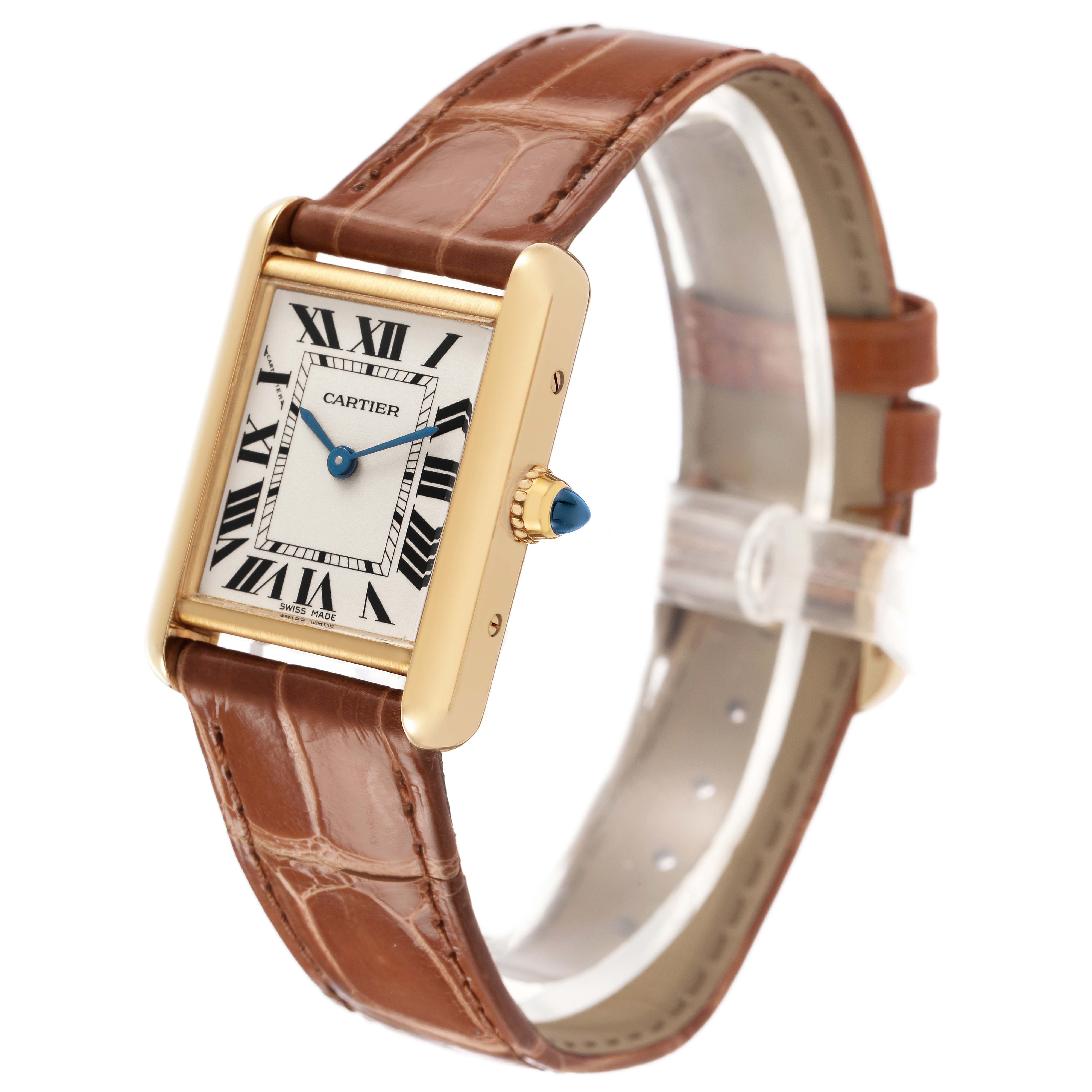 The Cartier Tank Louis W1529856 Women's Yellow Gold Silver Dial watch is shown at a three-quarter angle, displaying its rectangular case, brown leather strap, and blue cabochon crown.