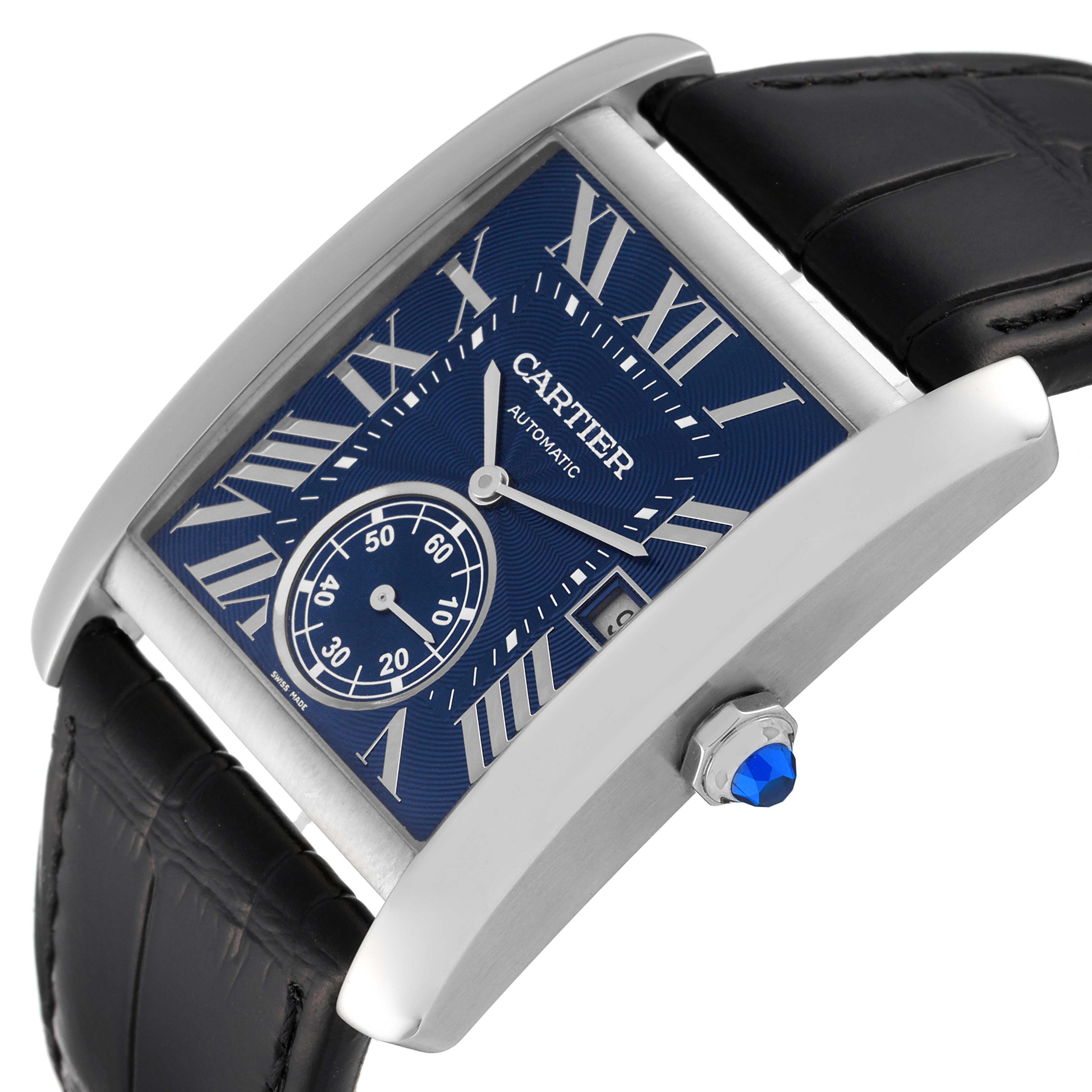 This image shows a Cartier Tank MC WSTA0010 Men
s Stainless Steel Blue Dial WSTA0010 Men
s Stainless Steel Blue Dial watch at a slanted angle, highlighting its blue dial, Roman numerals, sub-dial, and leather strap.