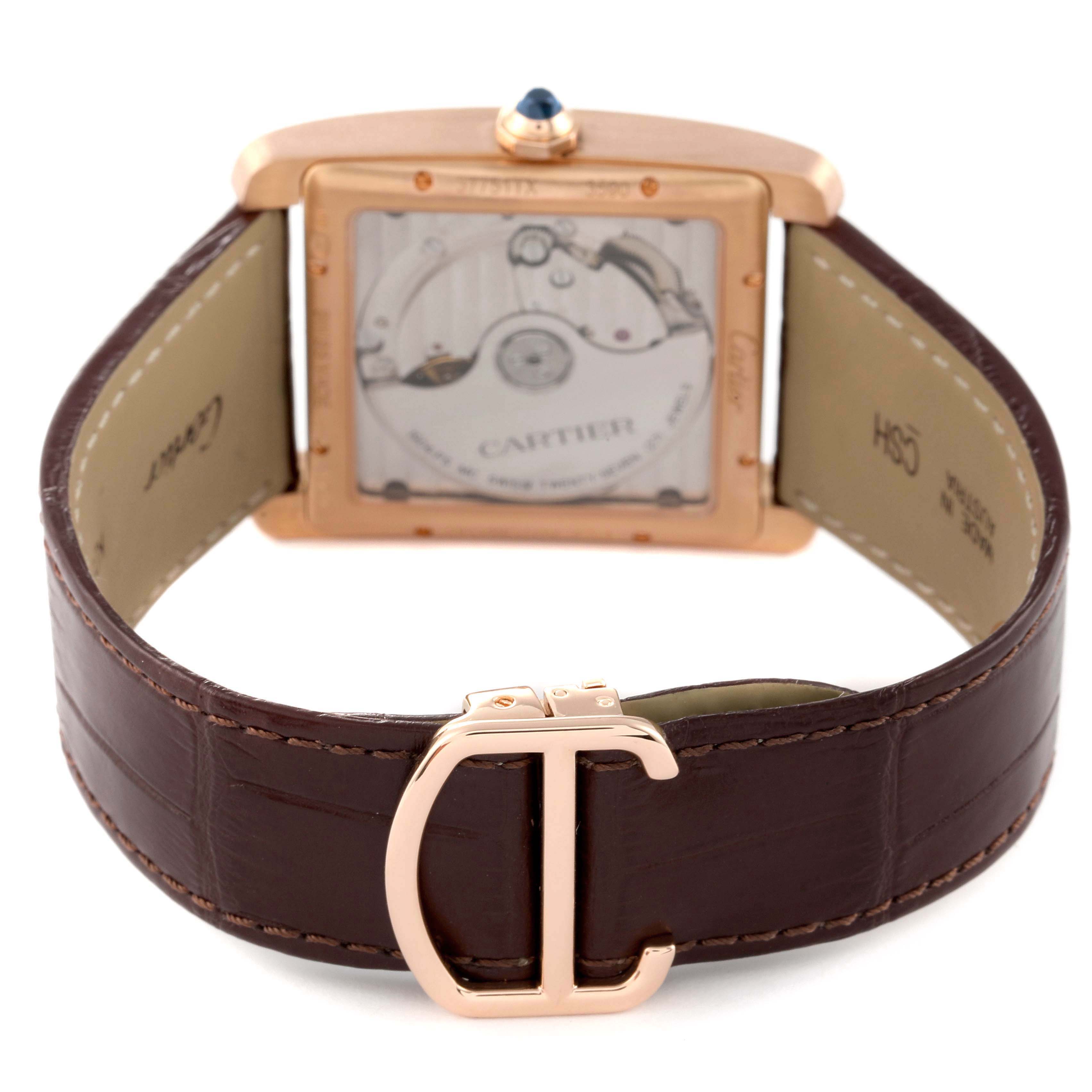 The image displays the back view of the Cartier Tank MC W5330002 Men's Rose Gold Brown Dial W5330002 Men's Rose Gold Brown Dial watch, highlighting its movement and brown leather strap.