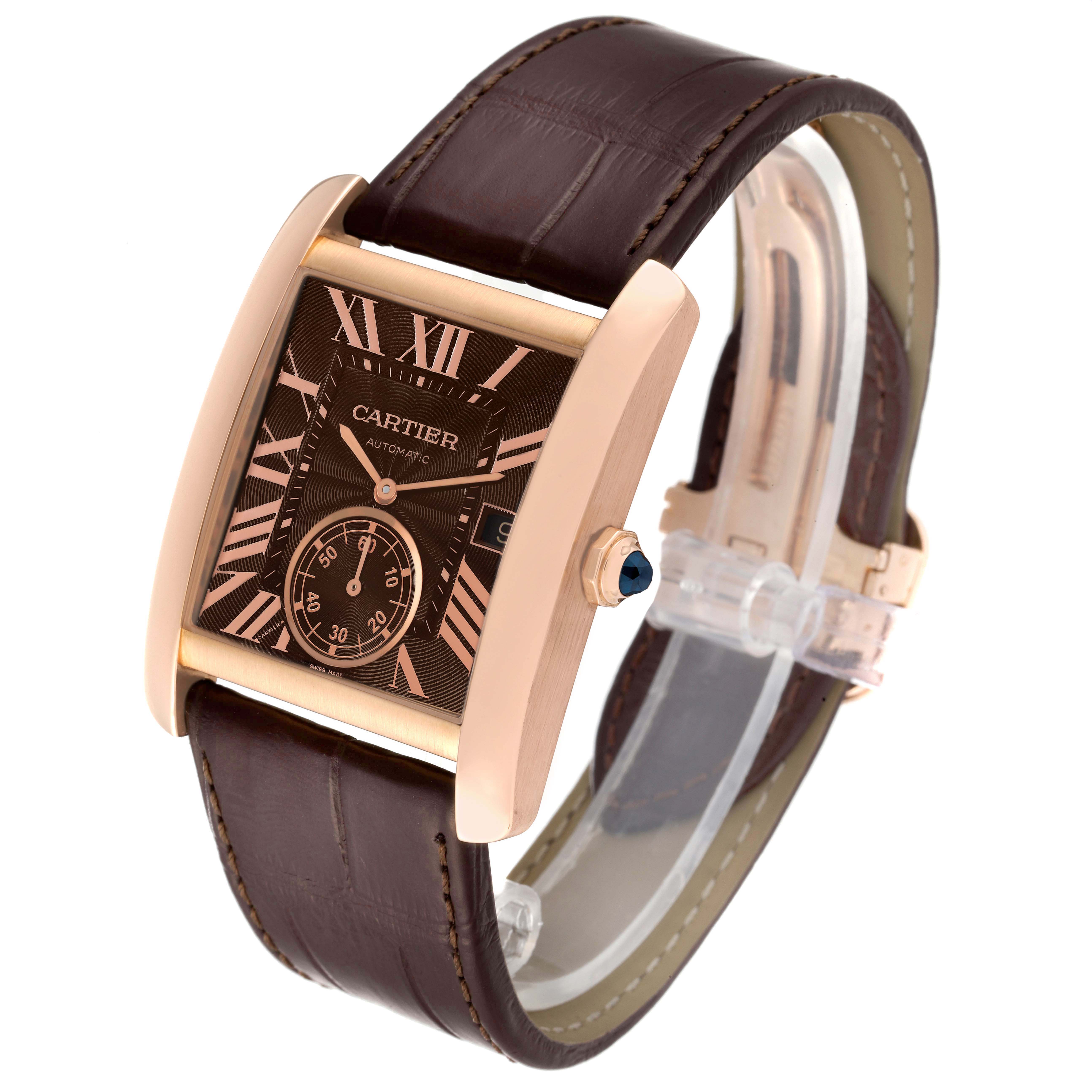 The Tank MC watch by Cartier is shown at an angle displaying its face, dial, case, and leather strap.