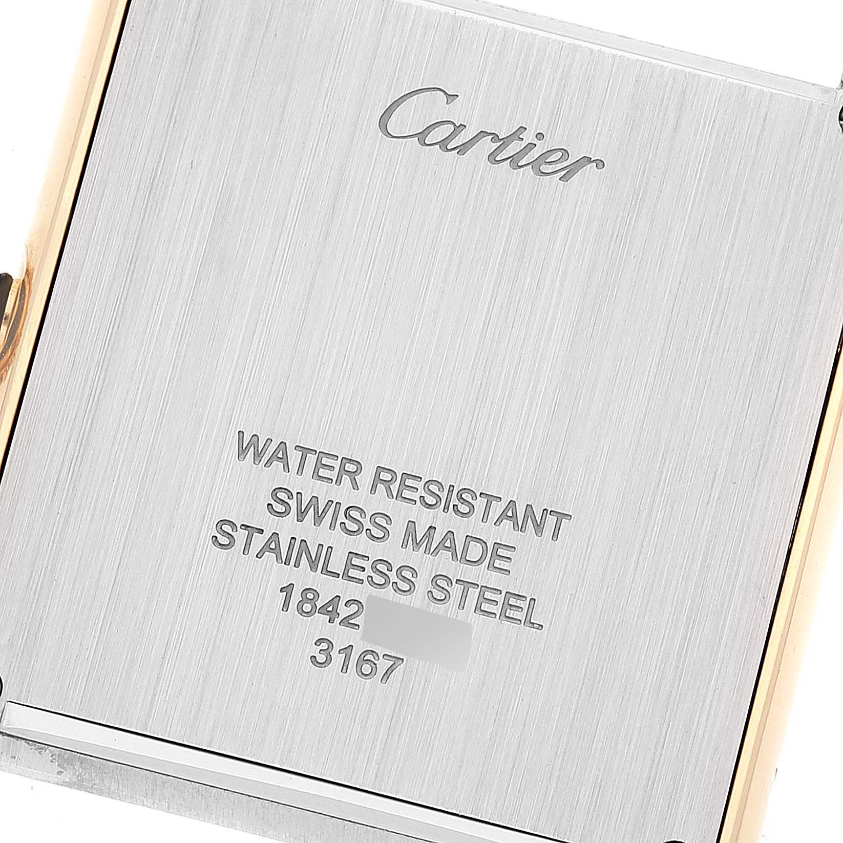 This is a close-up of the back case of a Tank Solo watch by Cartier, showing the brand name, water resistance, and other engravings.