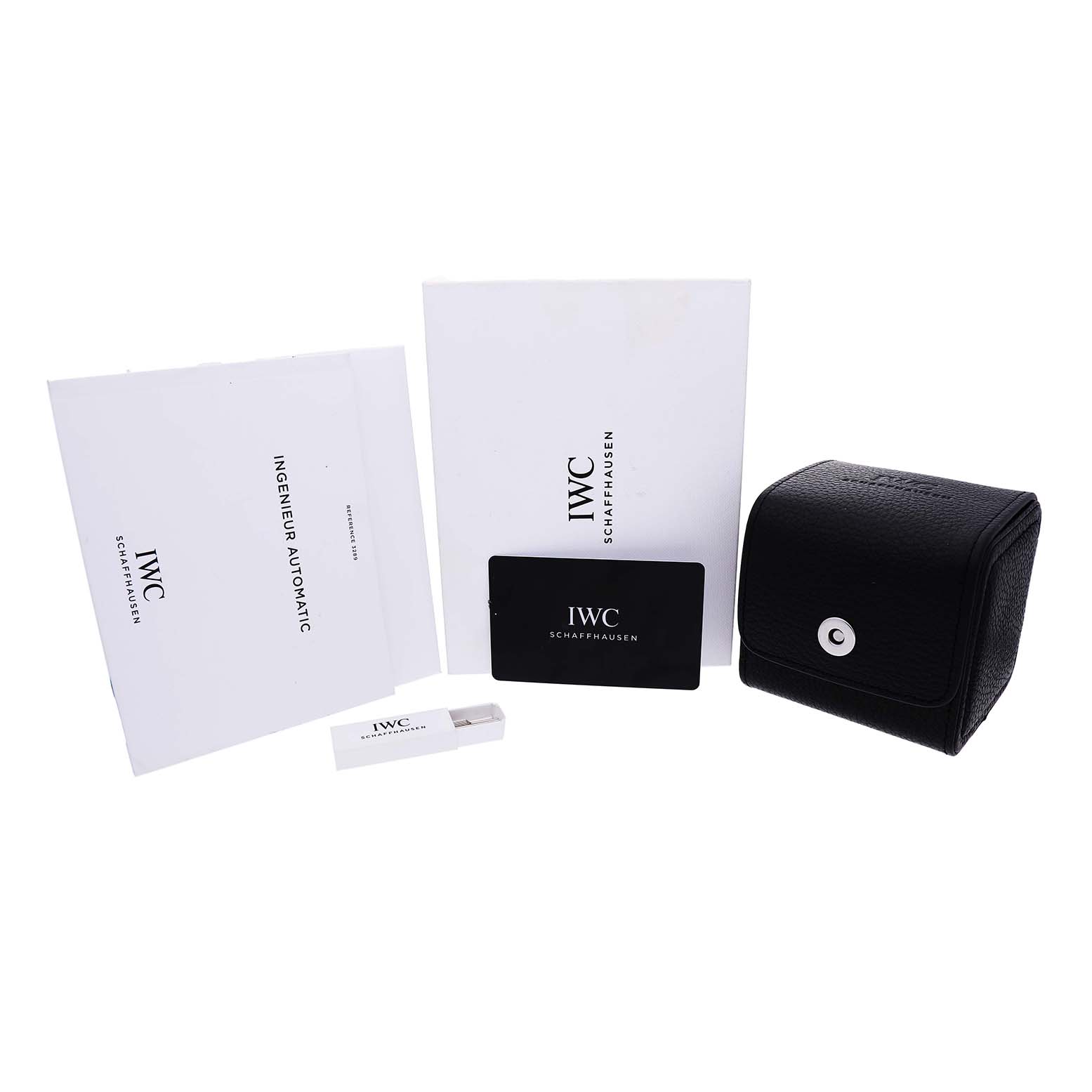 The image shows IWC Ingenieur IW328903 Men's Stainless Steel Blue Dial accessories including manuals, a card, USB, and a black case from a front angle.