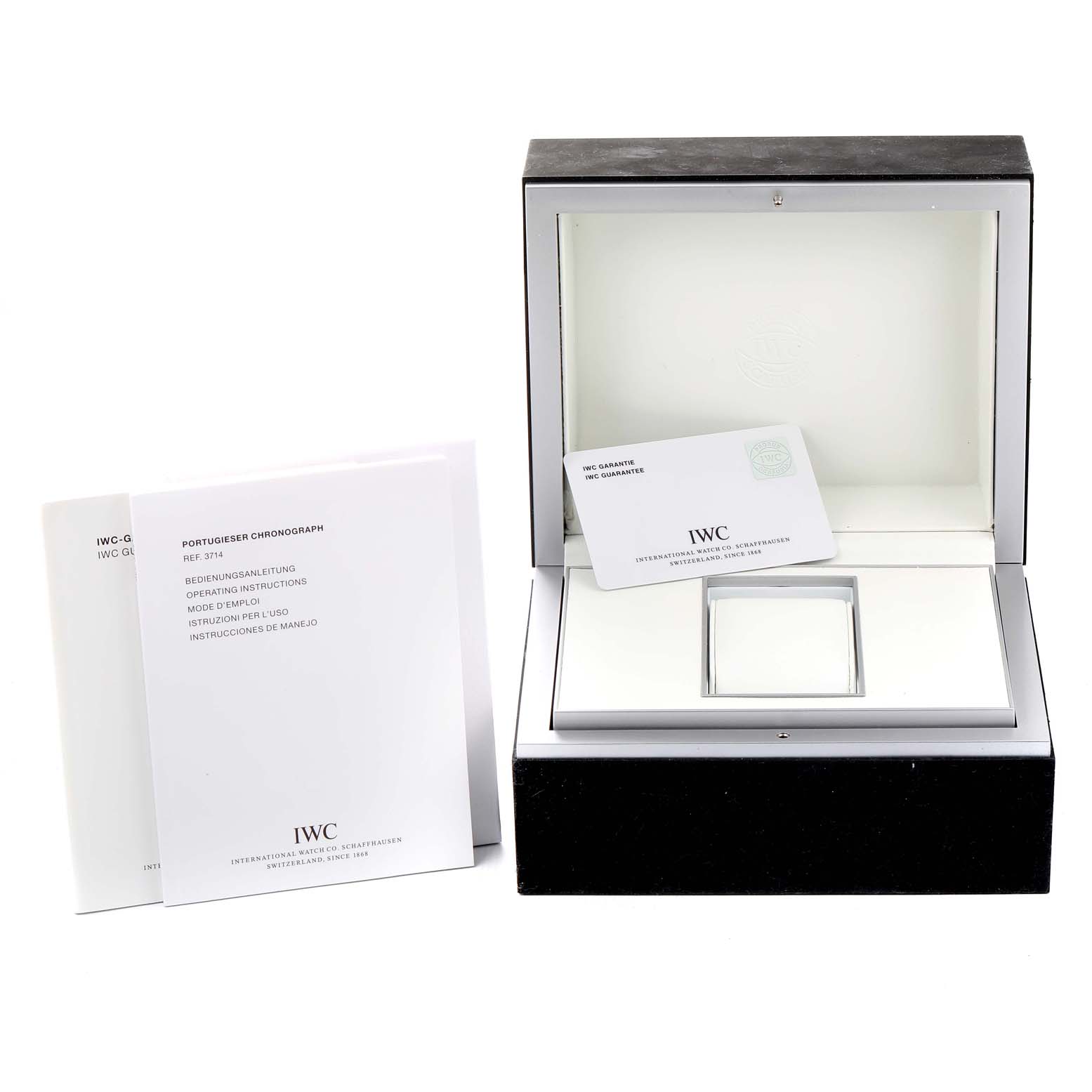 The image shows the open presentation box, warranty card, and user manuals for the IWC Portuguese IW371401 Men's Stainless Steel Silver Dial IW371401 Men's Stainless Steel Silver Dial model watch.