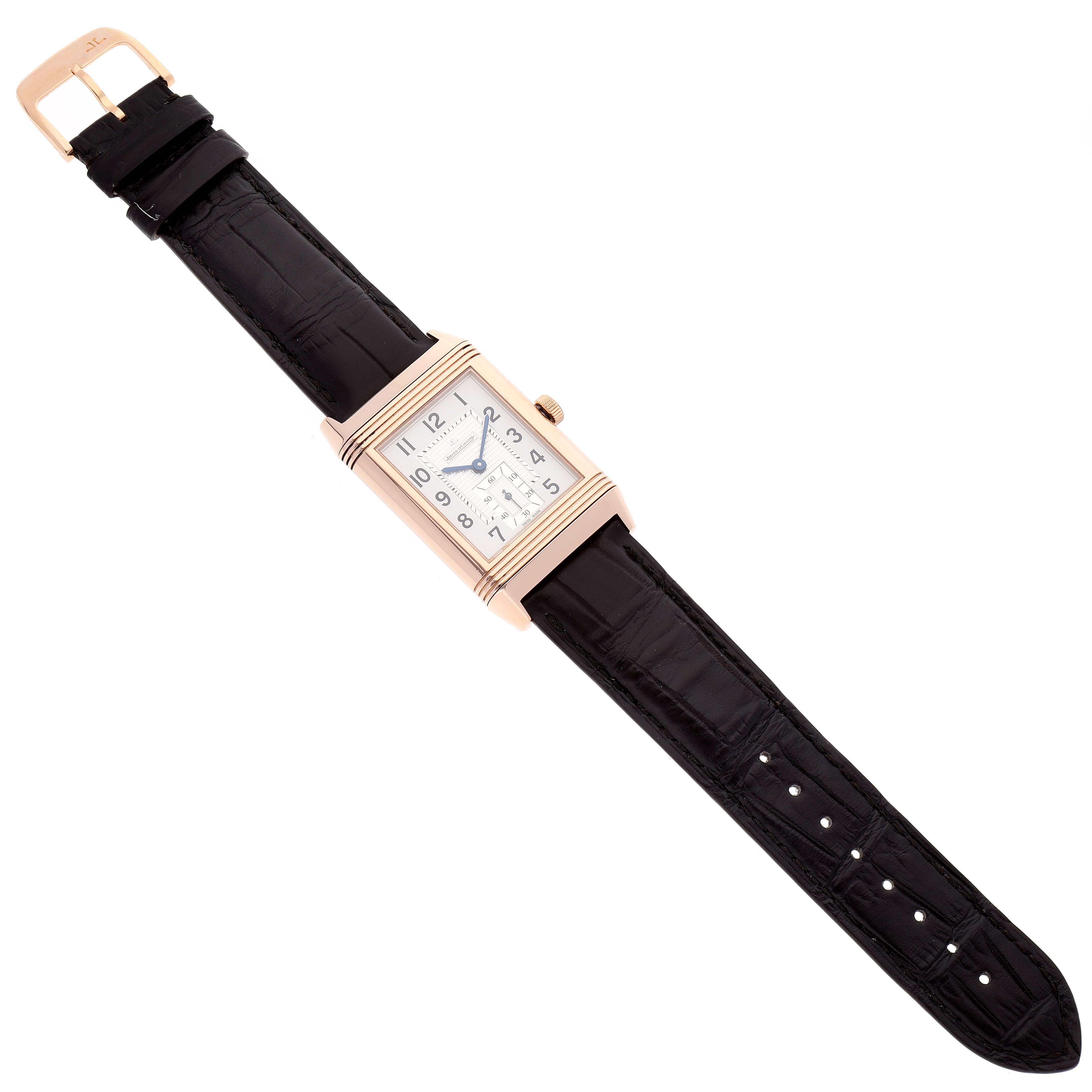 The image shows a full view of a Jaeger LeCoultre Reverso Q3732420 Men's Rose Gold Silver Dial Q3732420 Men's Rose Gold Silver Dial watch, highlighting the dial, case, black leather strap, and buckle.