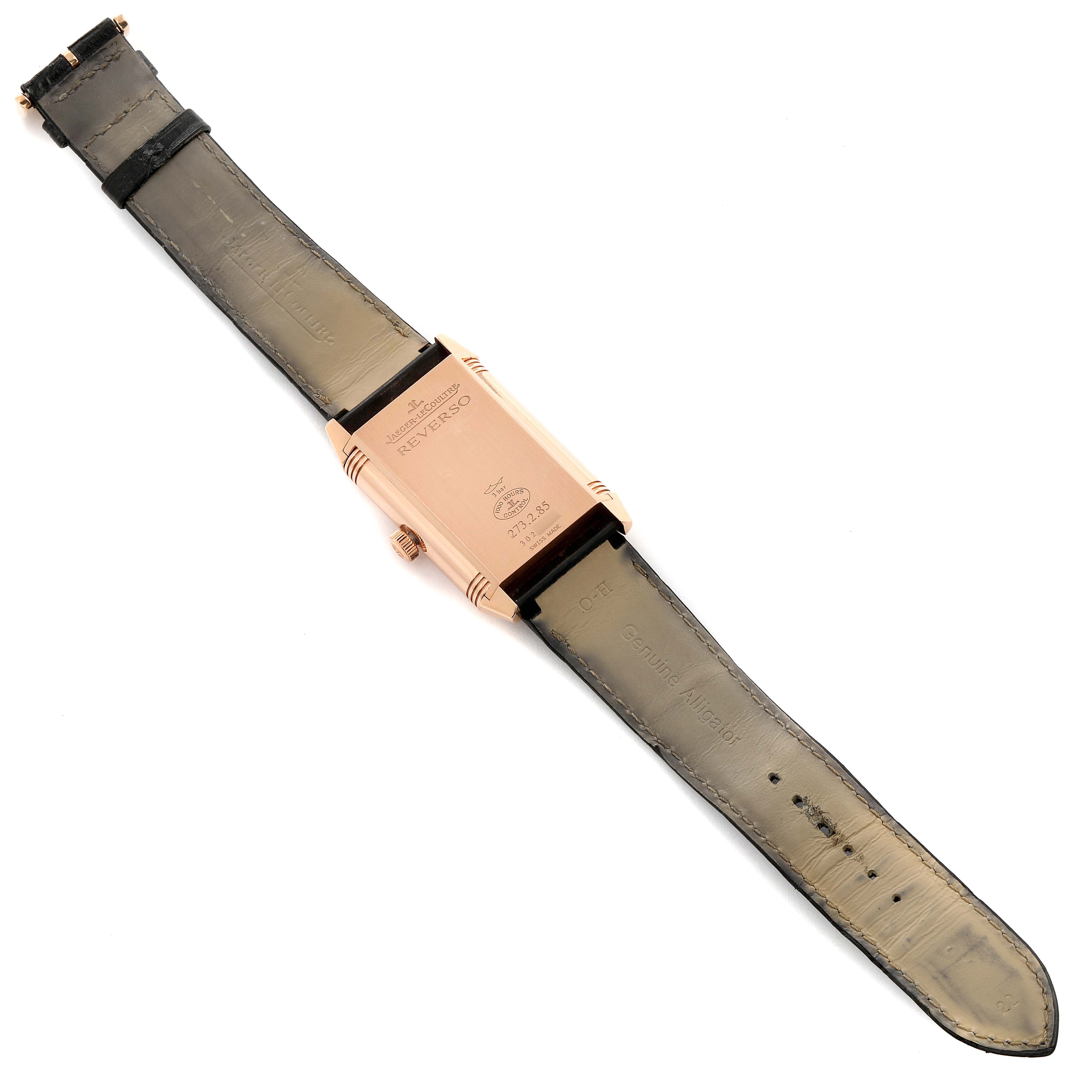 This image shows the back side of a Jaeger-LeCoultre Reverso watch with a leather strap.