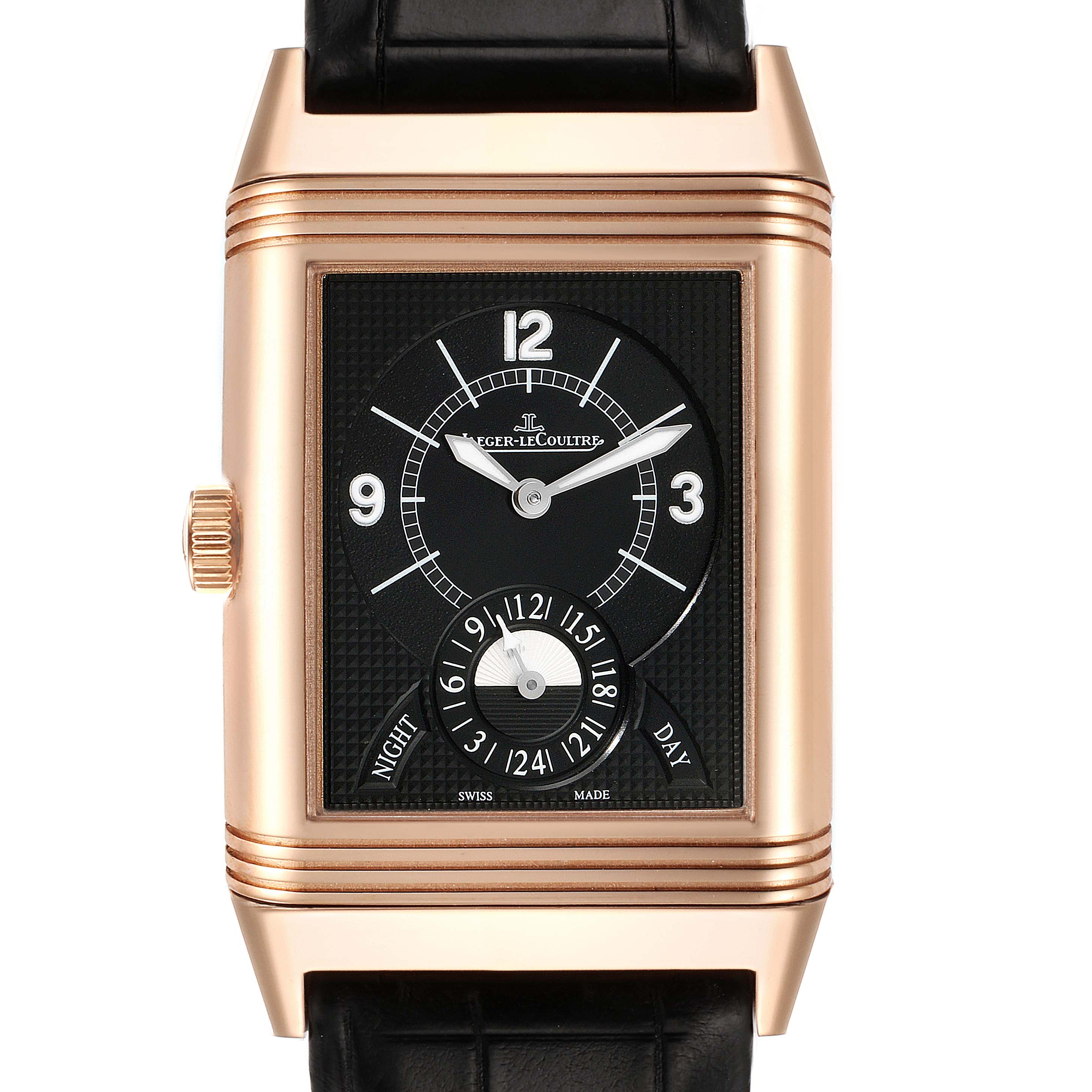 The Reverso model by Jaeger LeCoultre is shown from the front, displaying the dial, hands, and a day/night indicator.