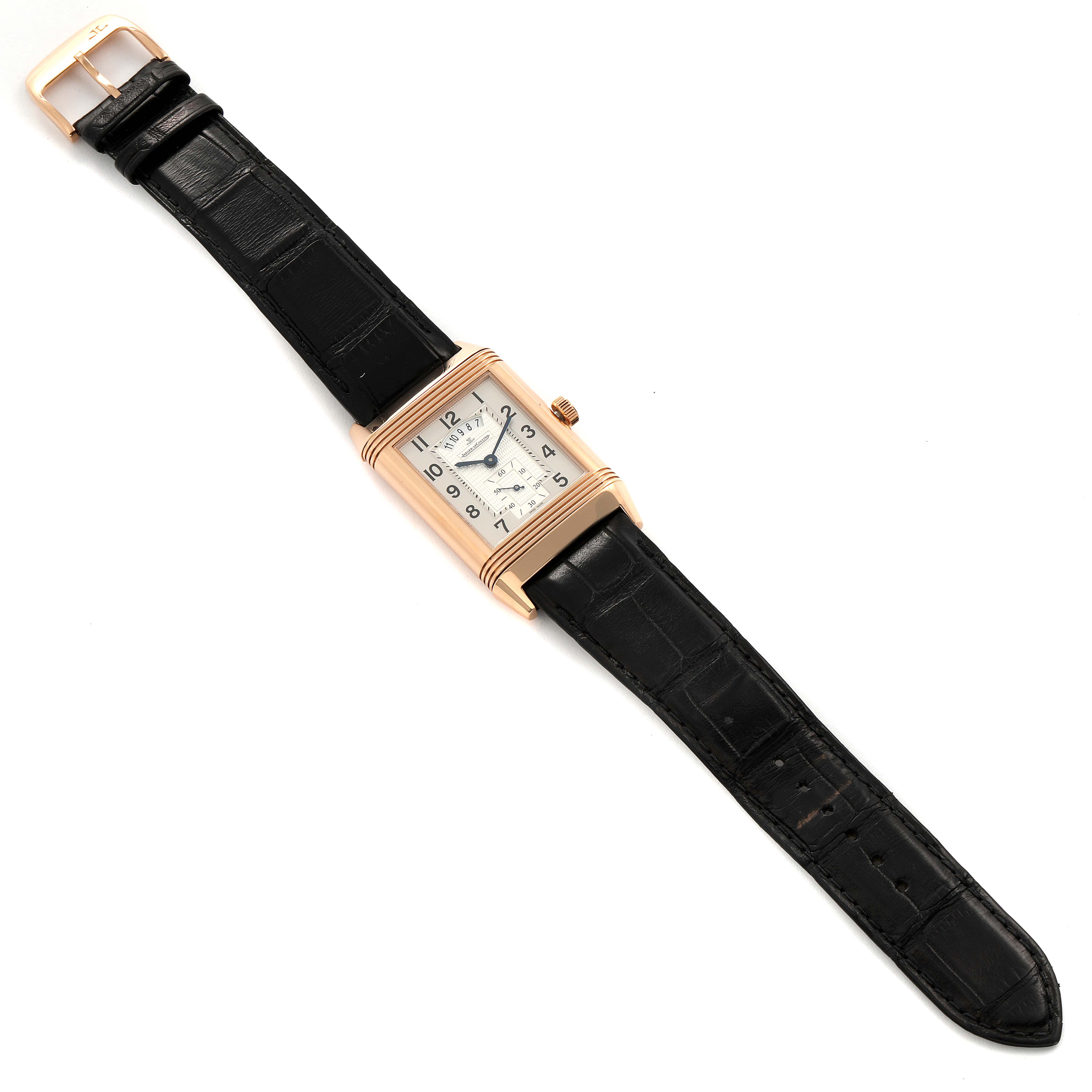 The image shows the Jaeger LeCoultre Reverso Q3742521 Men's Rose Gold Silver Dial Q3742521 Men's Rose Gold Silver Dial watch laid out flat, showcasing the face, bezel, crown, and black leather strap from a top perspective.