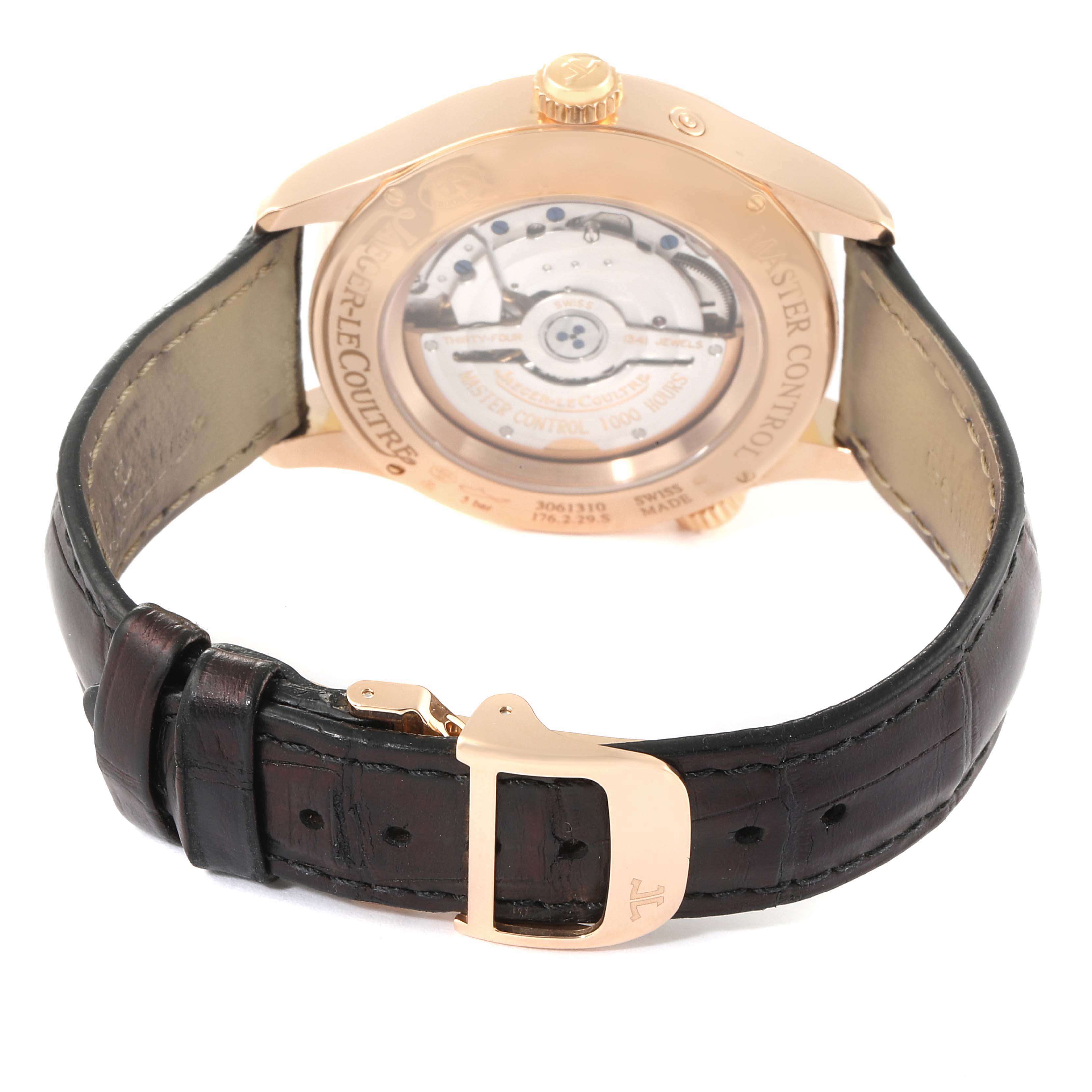 The image shows the back view of a Jaeger LeCoultre Master Q1422521 Men's Rose Gold Silver Dial Q1422521 Men's Rose Gold Silver Dial model watch, focusing on the movement and leather strap.