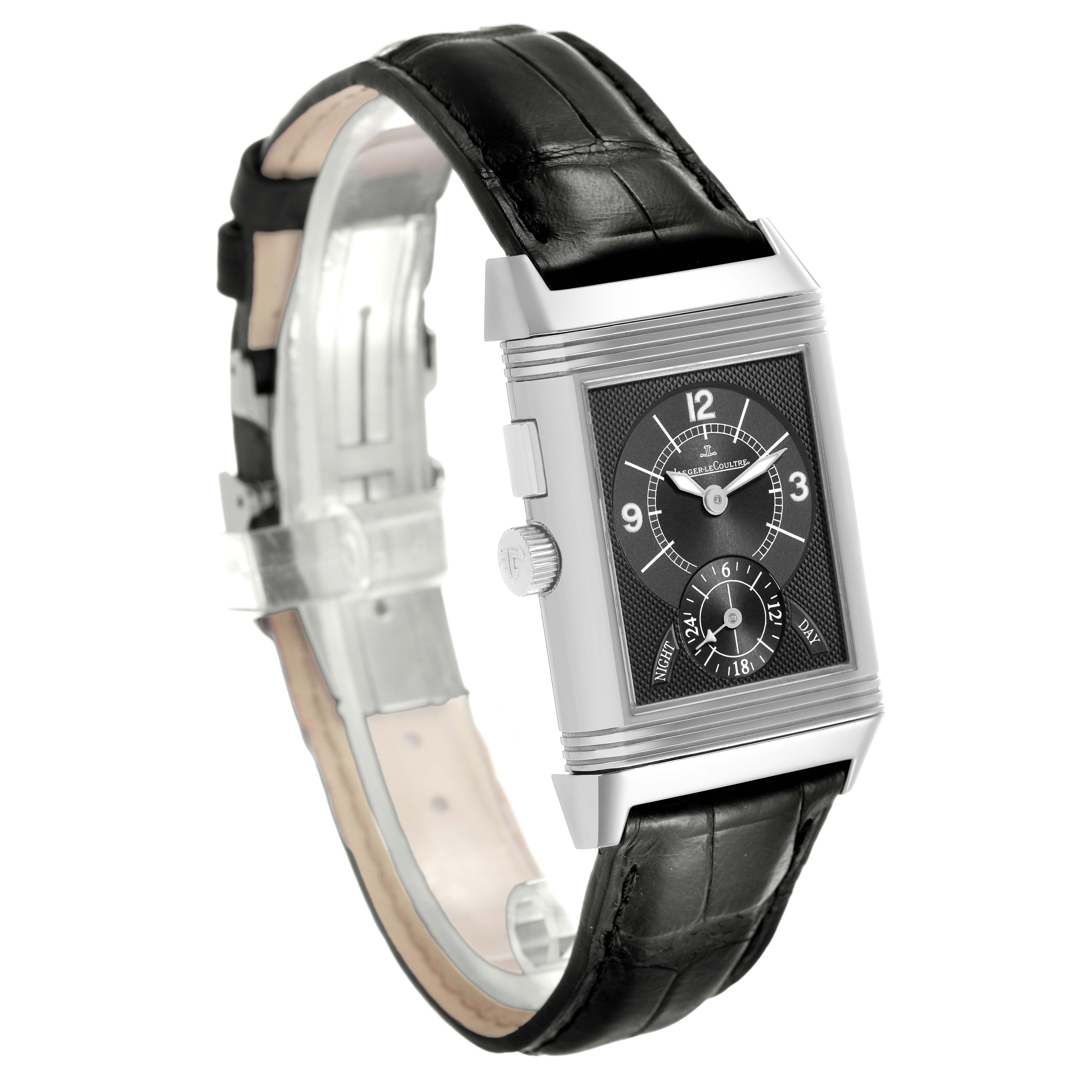 The Jaeger-LeCoultre Reverso watch is shown at a three-quarter angle, highlighting the face, crown, and black leather strap.