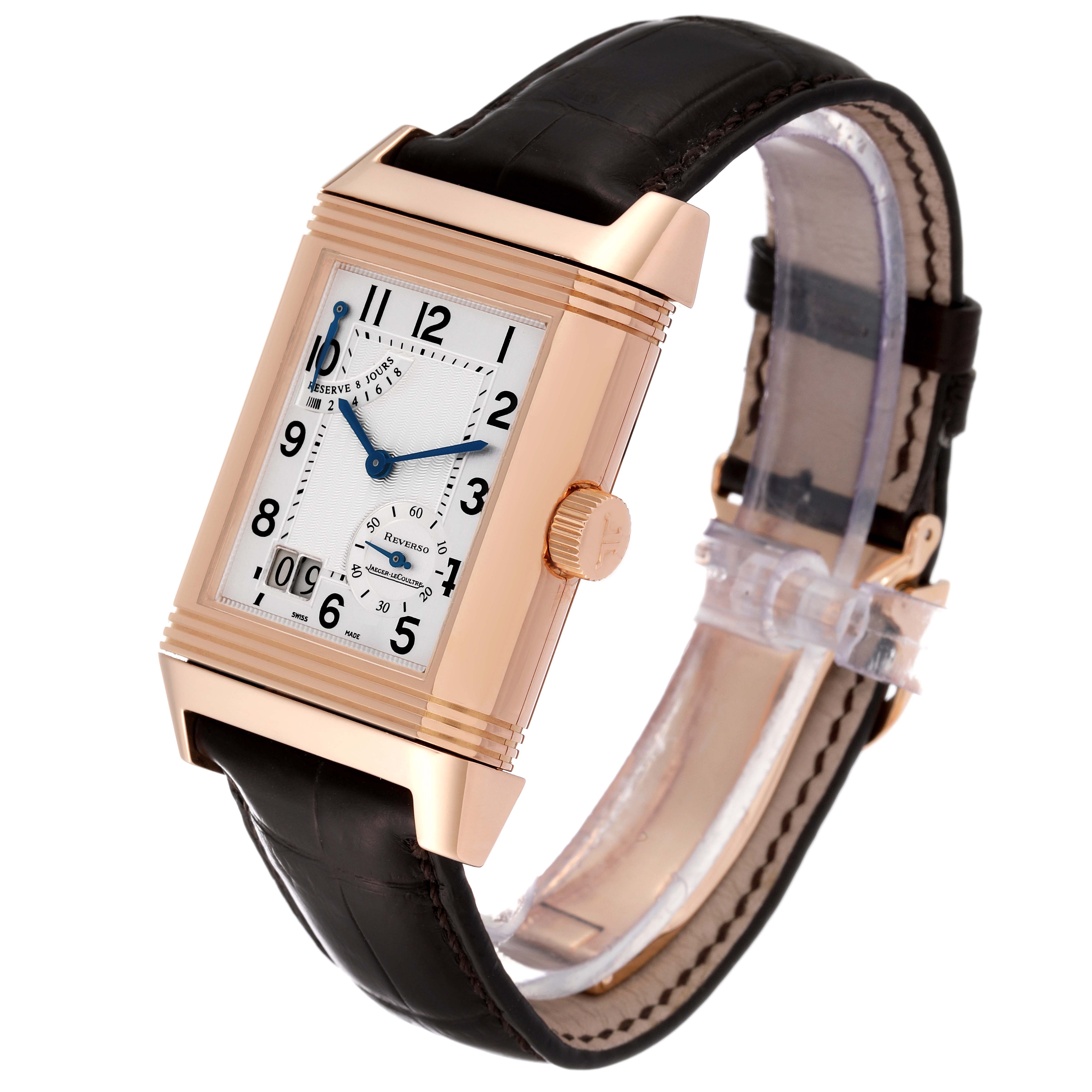 The image shows a Jaeger-LeCoultre Reverso watch from a front-side angle, highlighting its rectangular case, dial, crown, and leather strap.