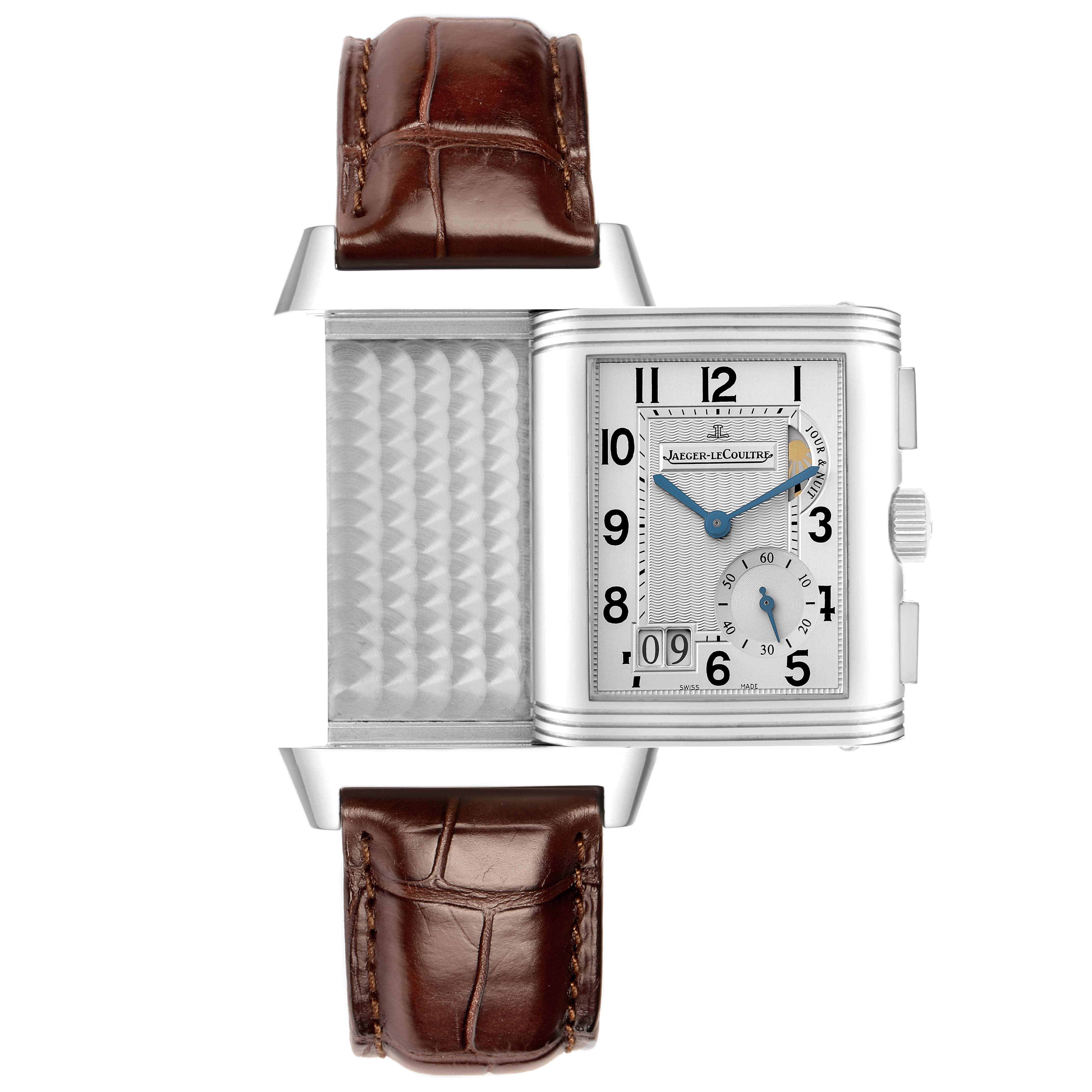 The Jaeger LeCoultre Reverso Q3028420 Men's Stainless Steel Silver Dial watch is shown from a front angle, highlighting its swiveling case and brown leather strap.