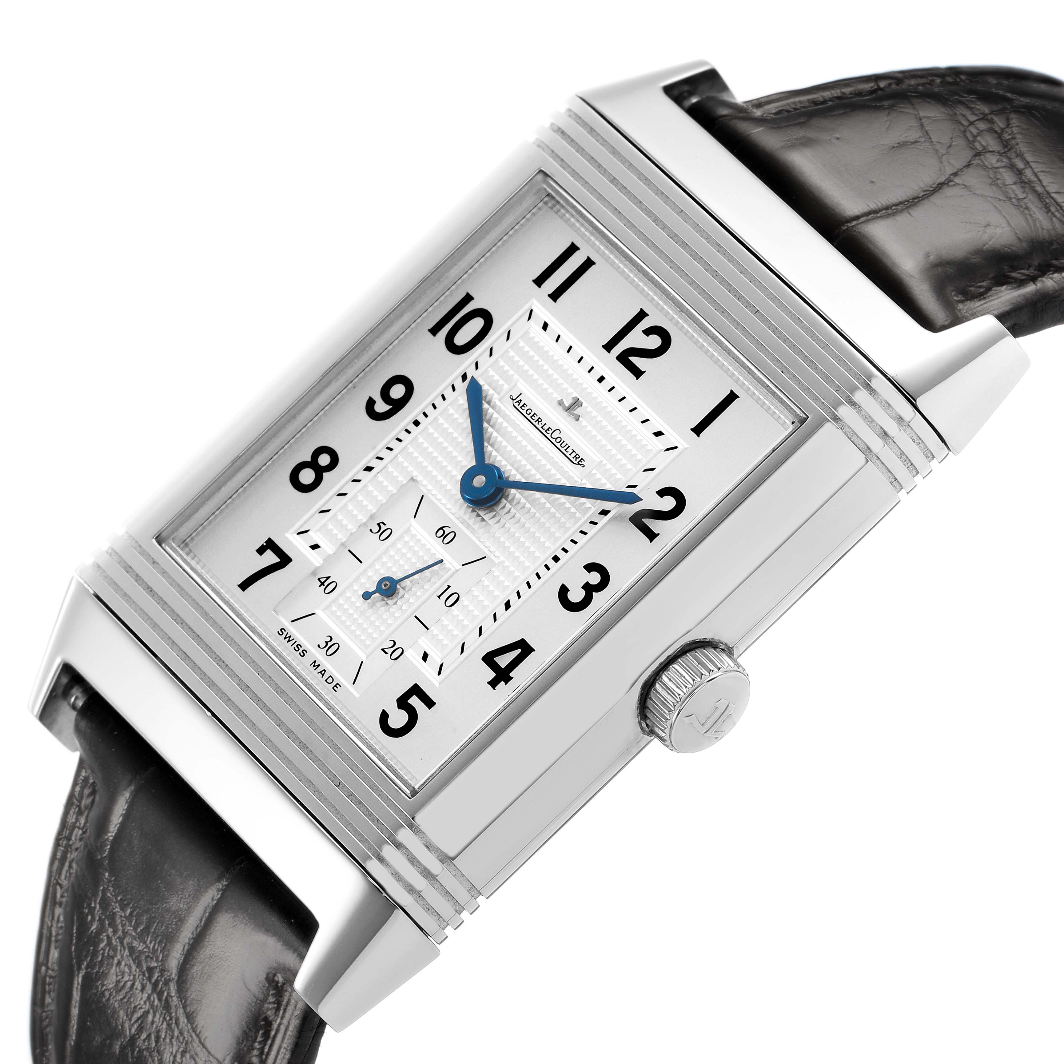 The Jaeger-LeCoultre Reverso watch is shown from a tilted angle, displaying the face, case edges, crown, and part of the strap.