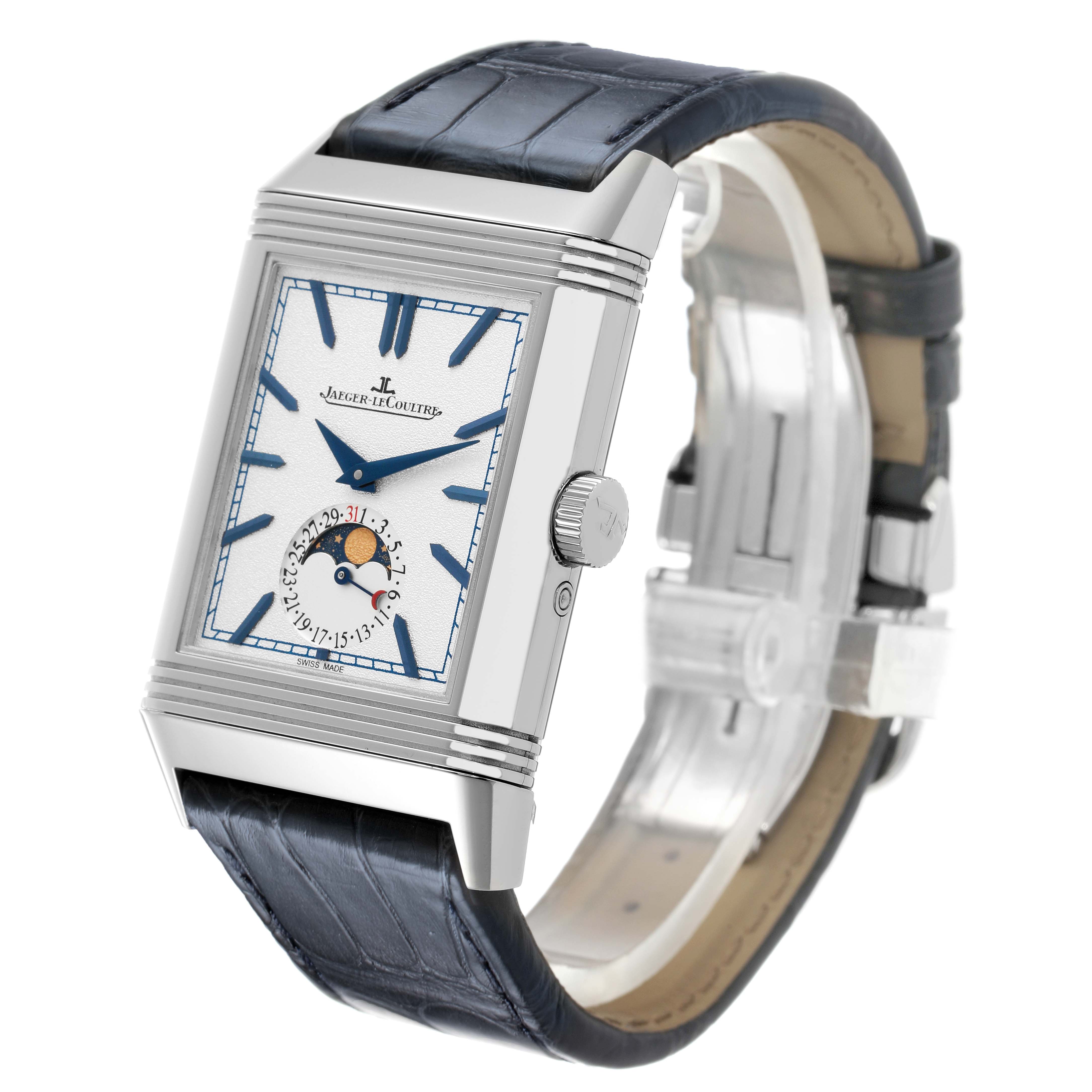 The Jaeger-LeCoultre Reverso watch is shown at a three-quarter angle, highlighting its dial, case, crown, and leather strap.