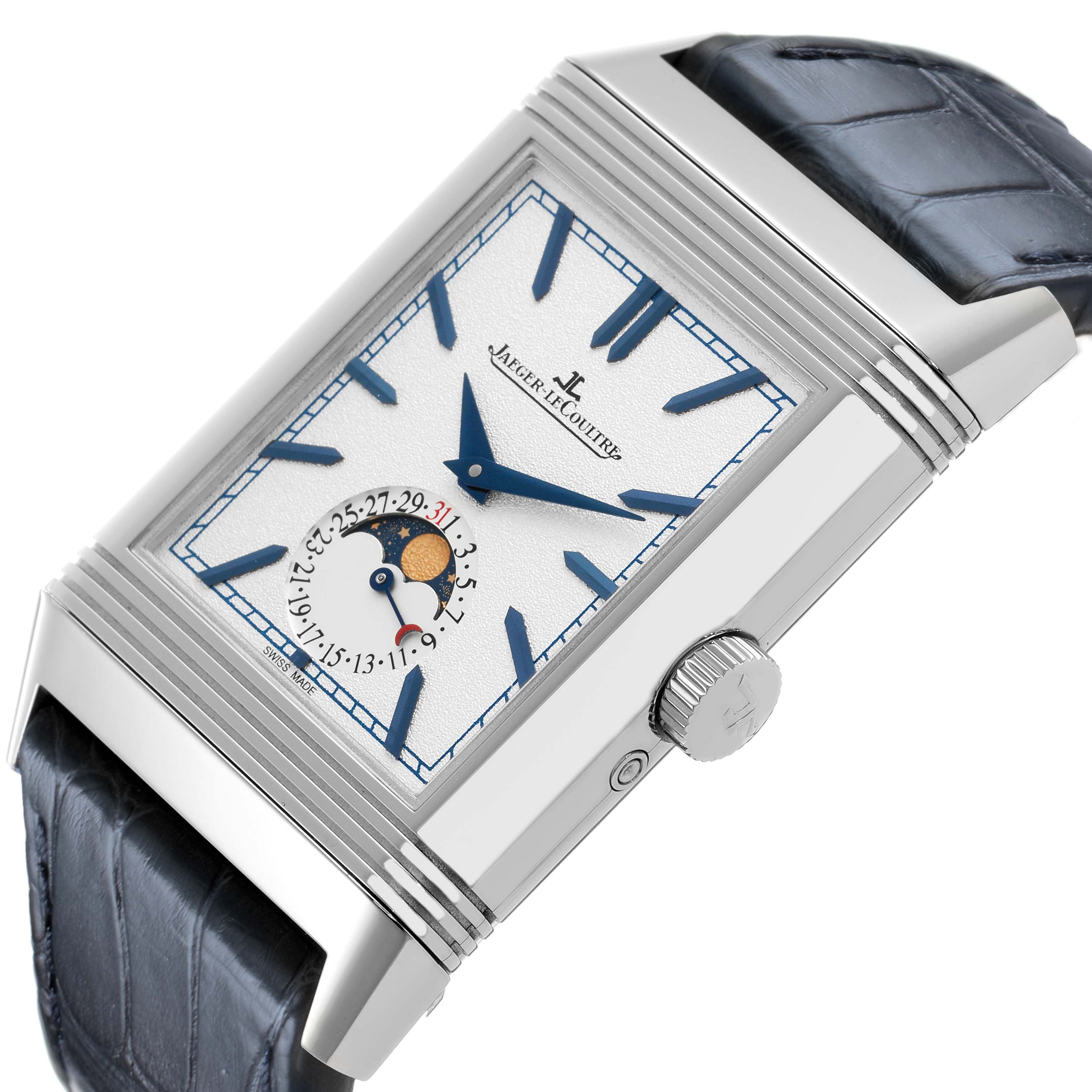 The Jaeger-LeCoultre Reverso watch is shown at a tilted angle, highlighting its rectangular case, crown, and moon phase subdial.