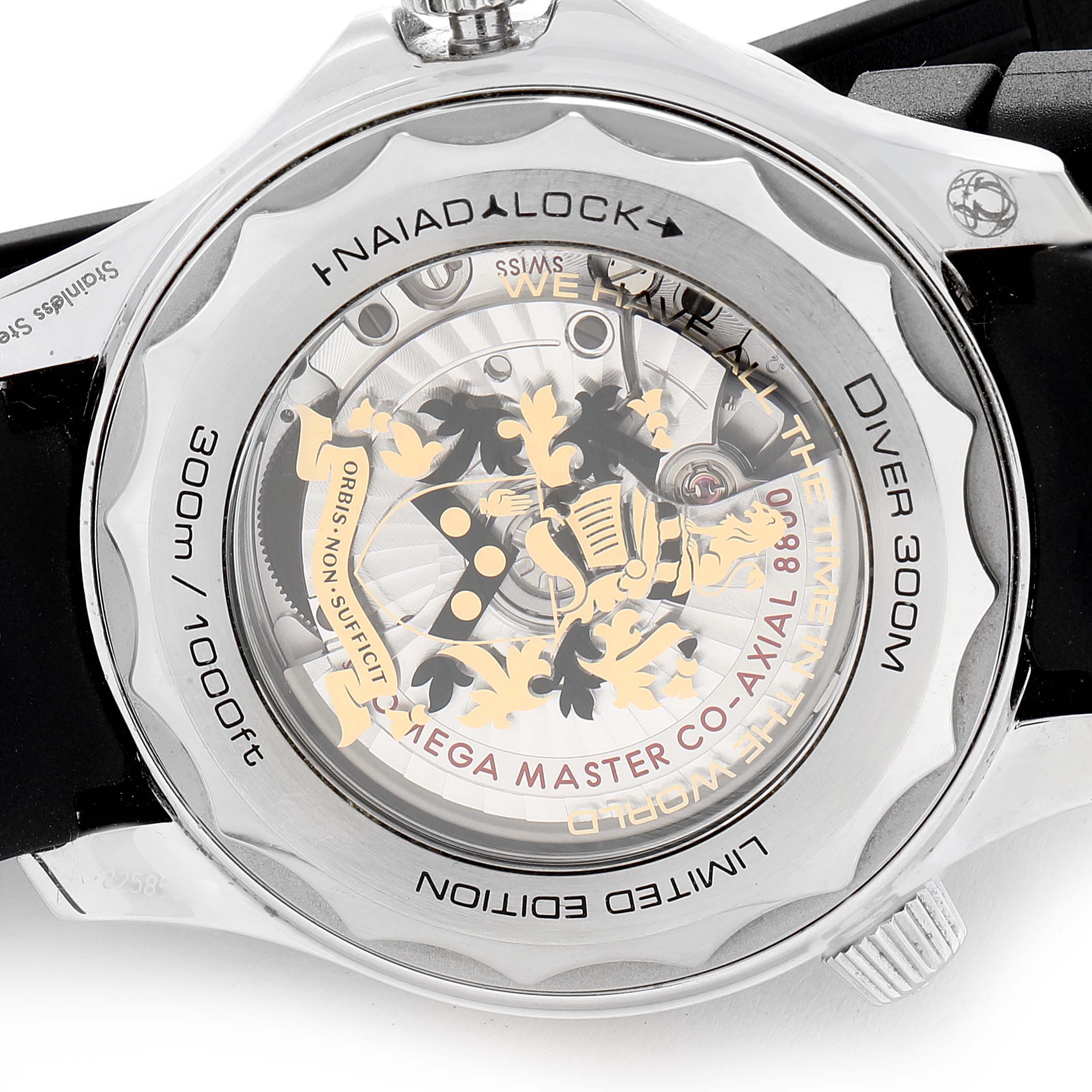 This image shows the back case and movement of an Omega Seamaster 210.22.42.20.01.004 Men's Stainless Steel Black Dial 210.22.42.20.01.004 Men's Stainless Steel Black Dial Diver 300M watch, highlighting its Naiad Lock feature and decorative interior.