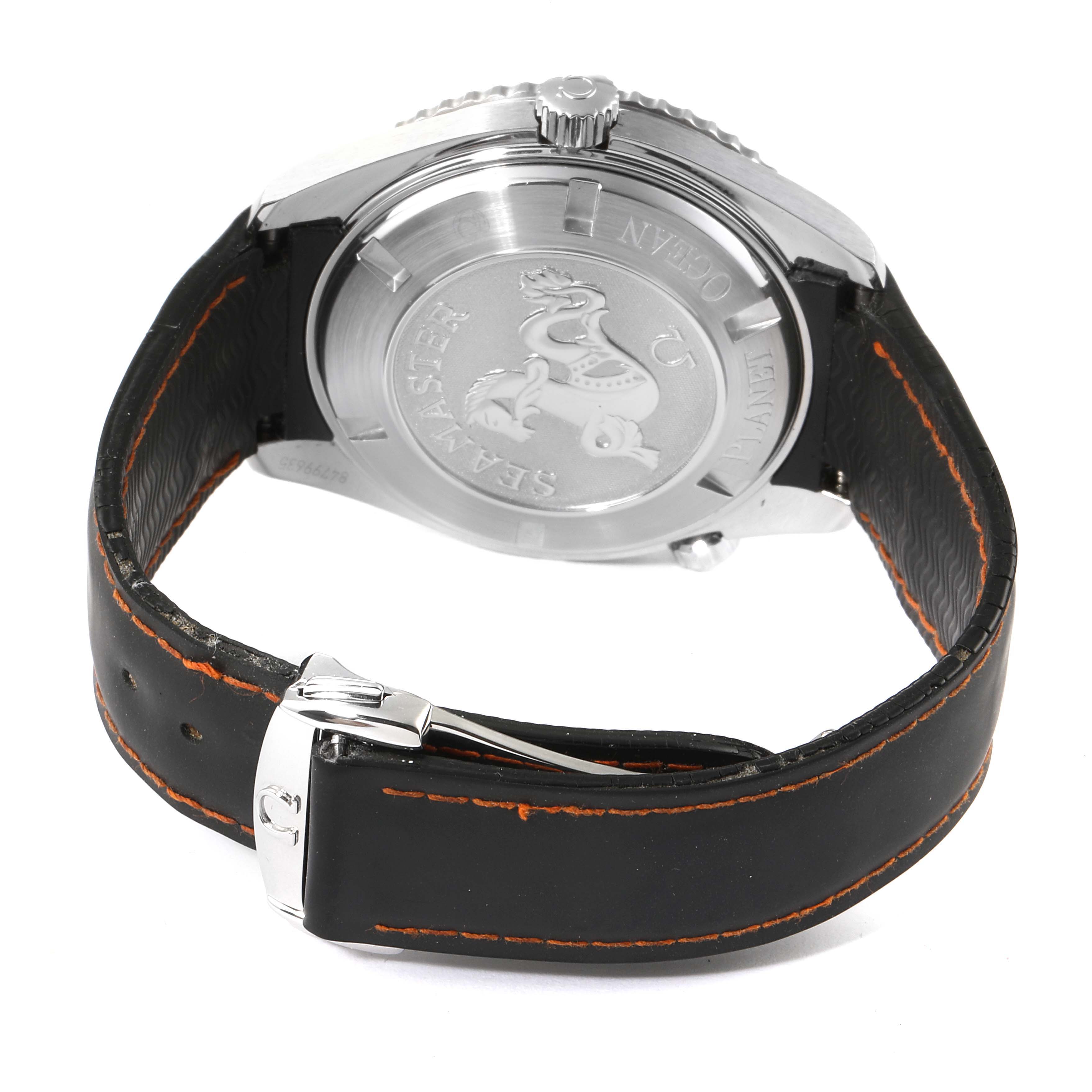 This image shows the Omega Planet Ocean 232.32.46.21.01.001 Men's Stainless Steel Black Dial 232.32.46.21.01.001 Men's Stainless Steel Black Dial watch from a rear angle, displaying the case back and part of the leather strap with the buckle.