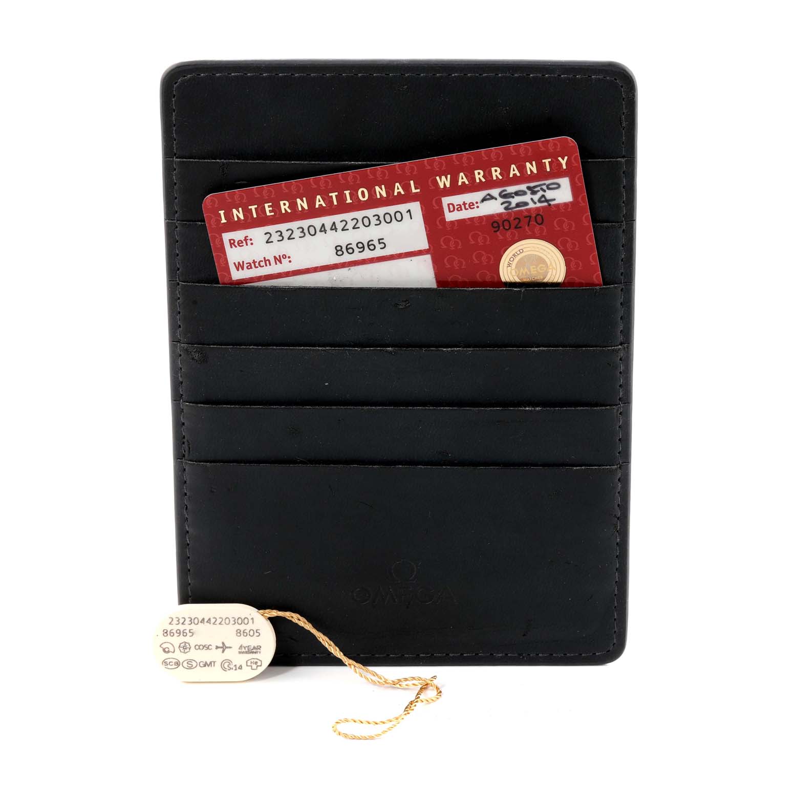 The image shows an Omega Planet Ocean 232.30.44.22.03.001 Men
s Stainless Steel Blue Dial 232.30.44.22.03.001 Men
s Stainless Steel Blue Dial model
s international warranty card and a label with reference numbers, placed in and in front of a leather card holder.