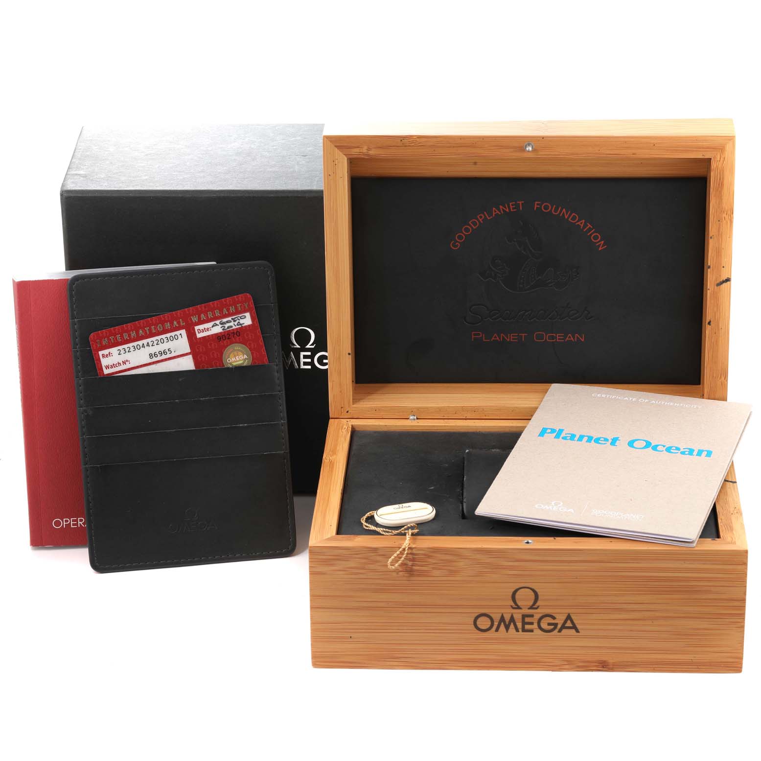 The image features the packaging and accessories for the Omega Planet Ocean 232.30.44.22.03.001 Men
s Stainless Steel Blue Dial 232.30.44.22.03.001 Men
s Stainless Steel Blue Dial model, including the box, warranty card, and manual.