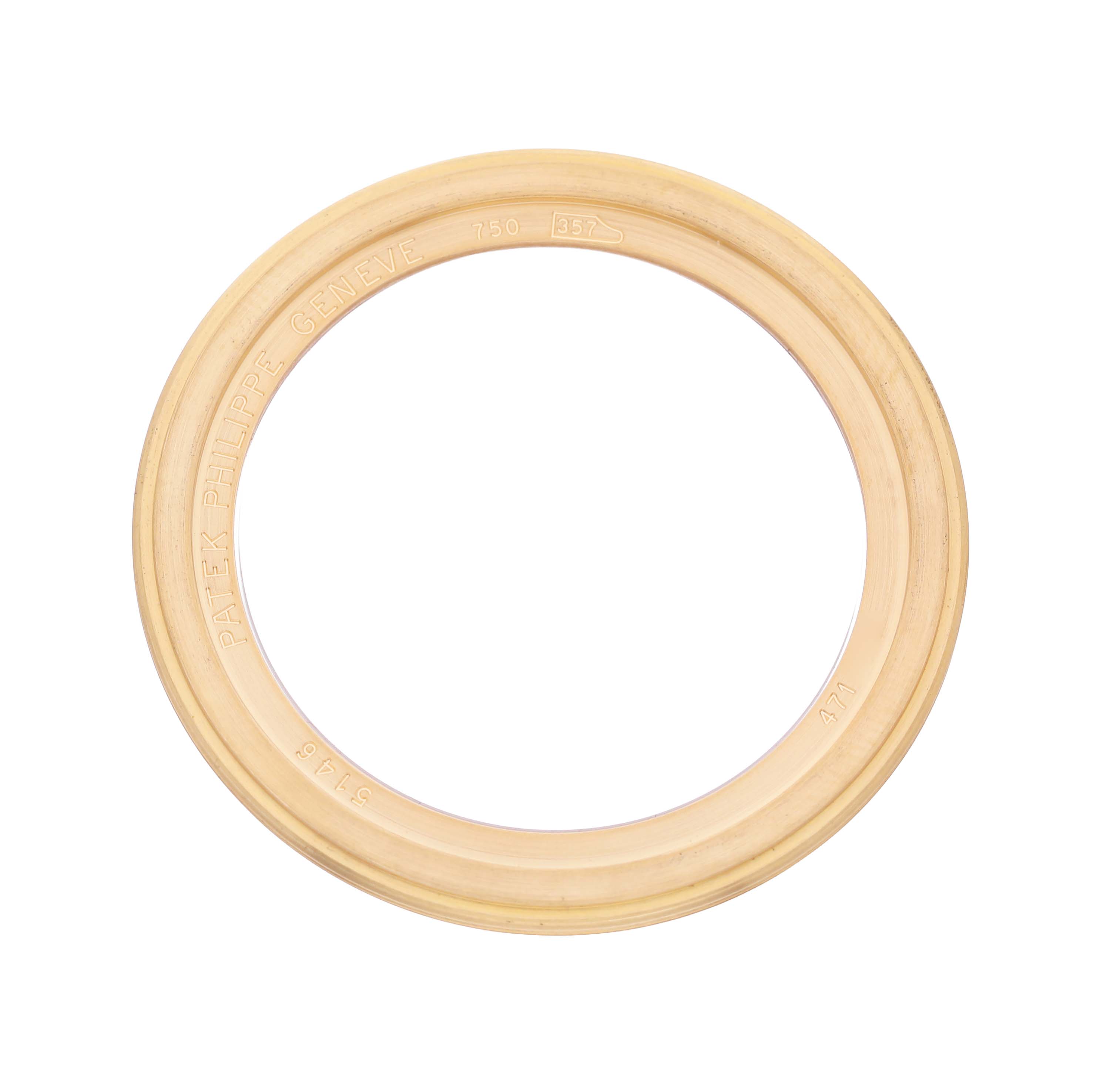 The image shows a gold watch bezel from the Complications model by Patek Philippe, viewed from above.
