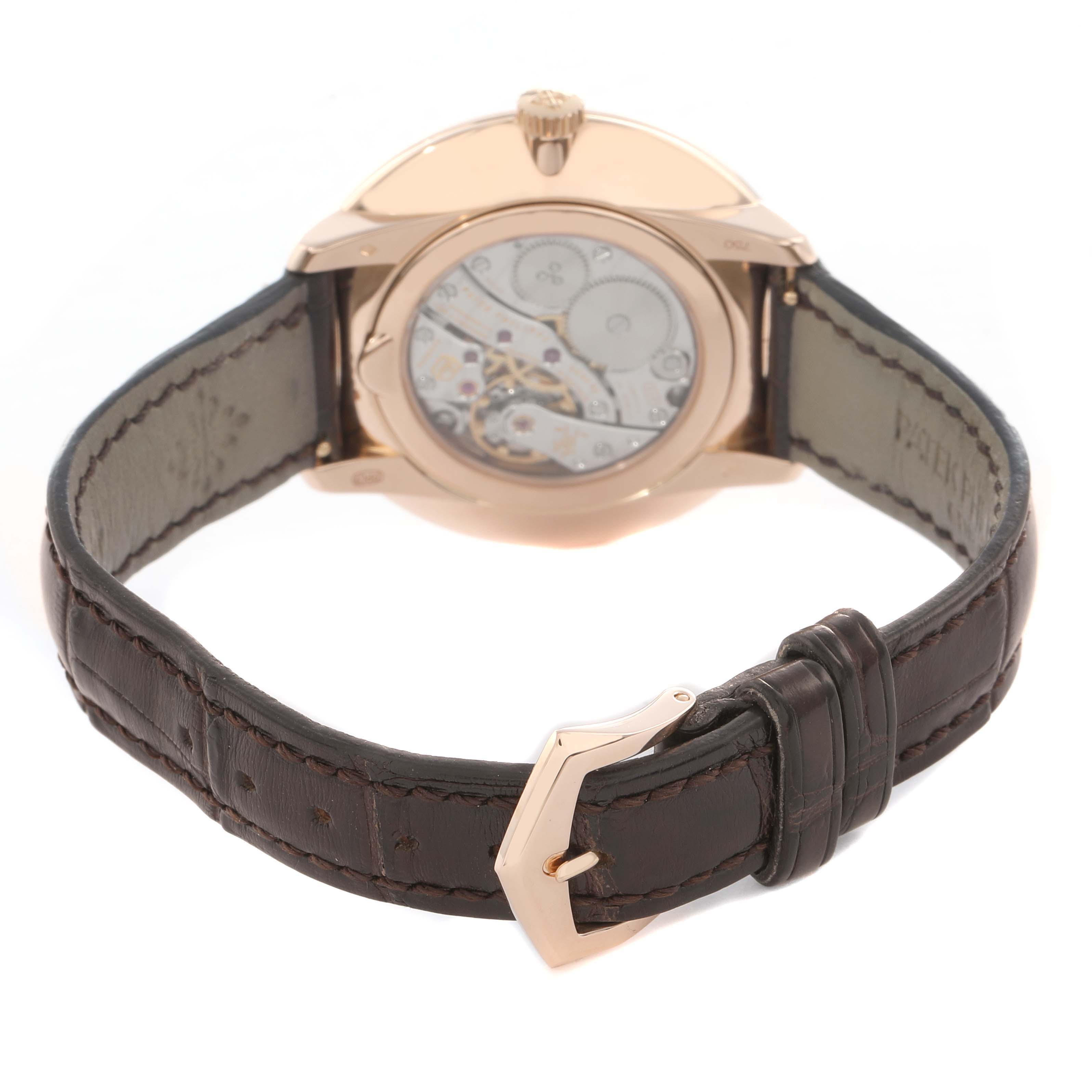 The image shows the back view of a Patek Philippe Calatrava 5123R Men
s Rose Gold Silver Dial watch, displaying its movement and leather strap.