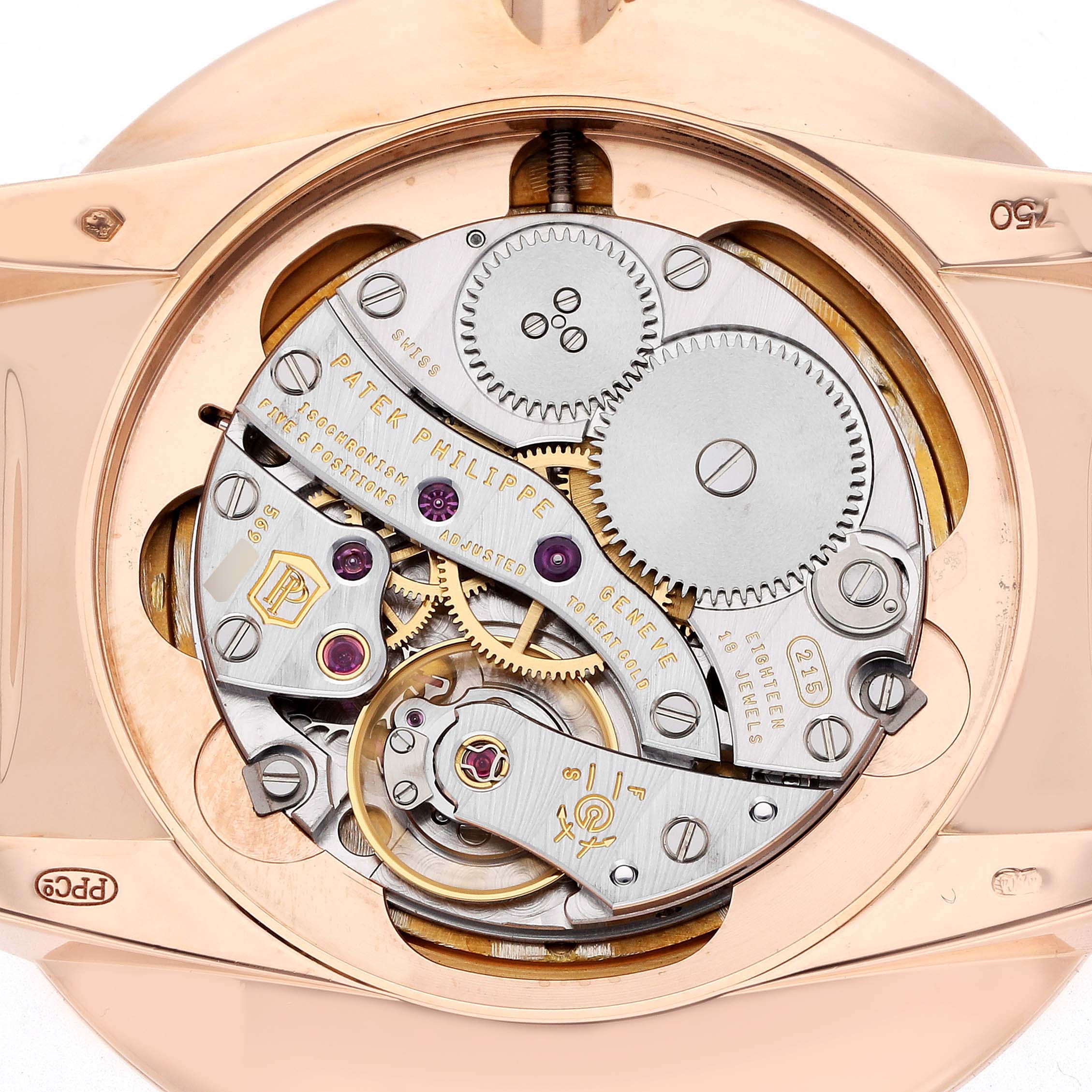 The image shows a close-up, rear view of the Patek Philippe Calatrava 5123R Men
s Rose Gold Silver Dial watch
s intricate movement and gears.