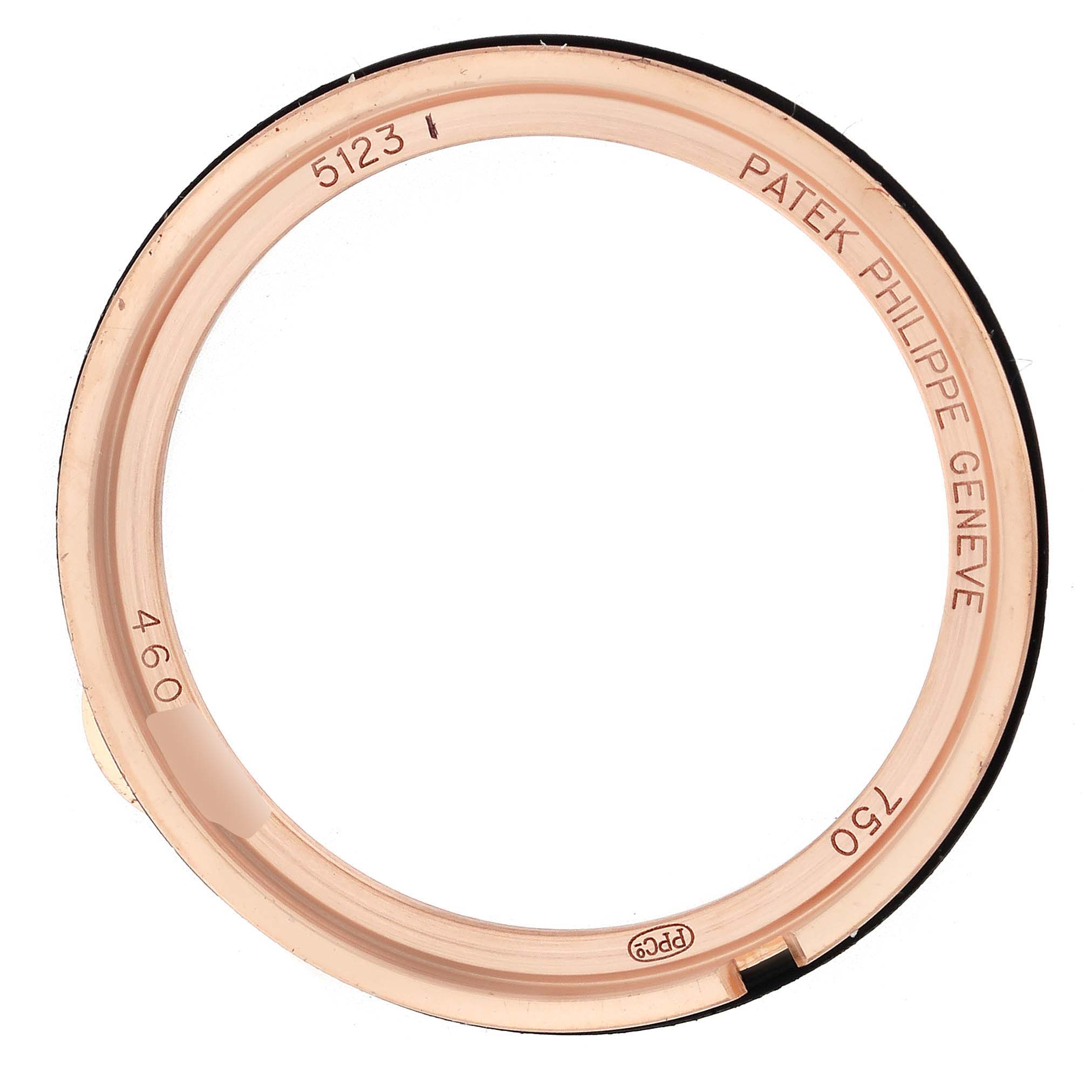 The image shows a top-down view of the Calatrava Patek Philippe watch bezel with engraved details.