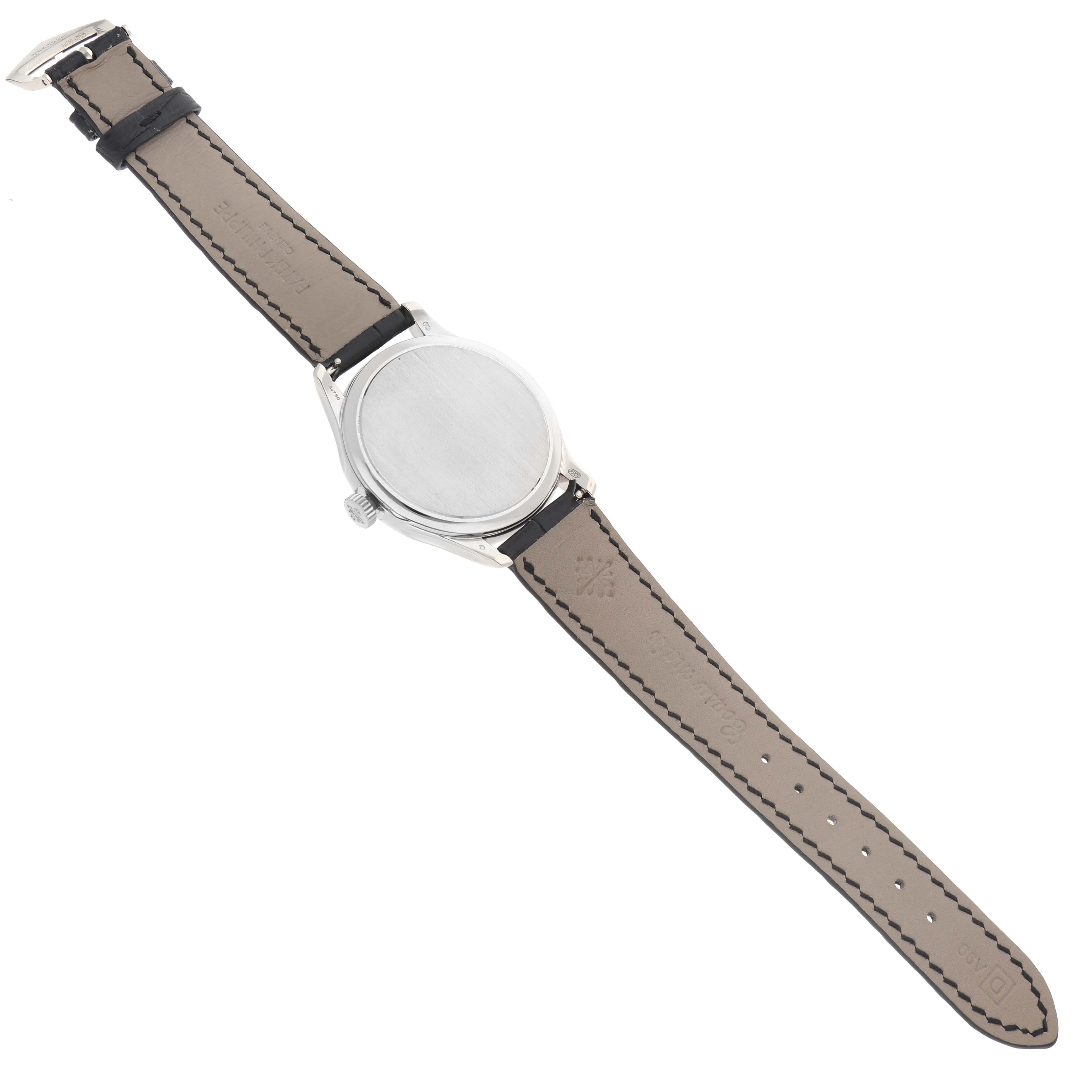 The Patek Philippe Calatrava 5227G Men
s White Gold Black Dial watch is shown from a rear view, emphasizing the case back and leather strap.