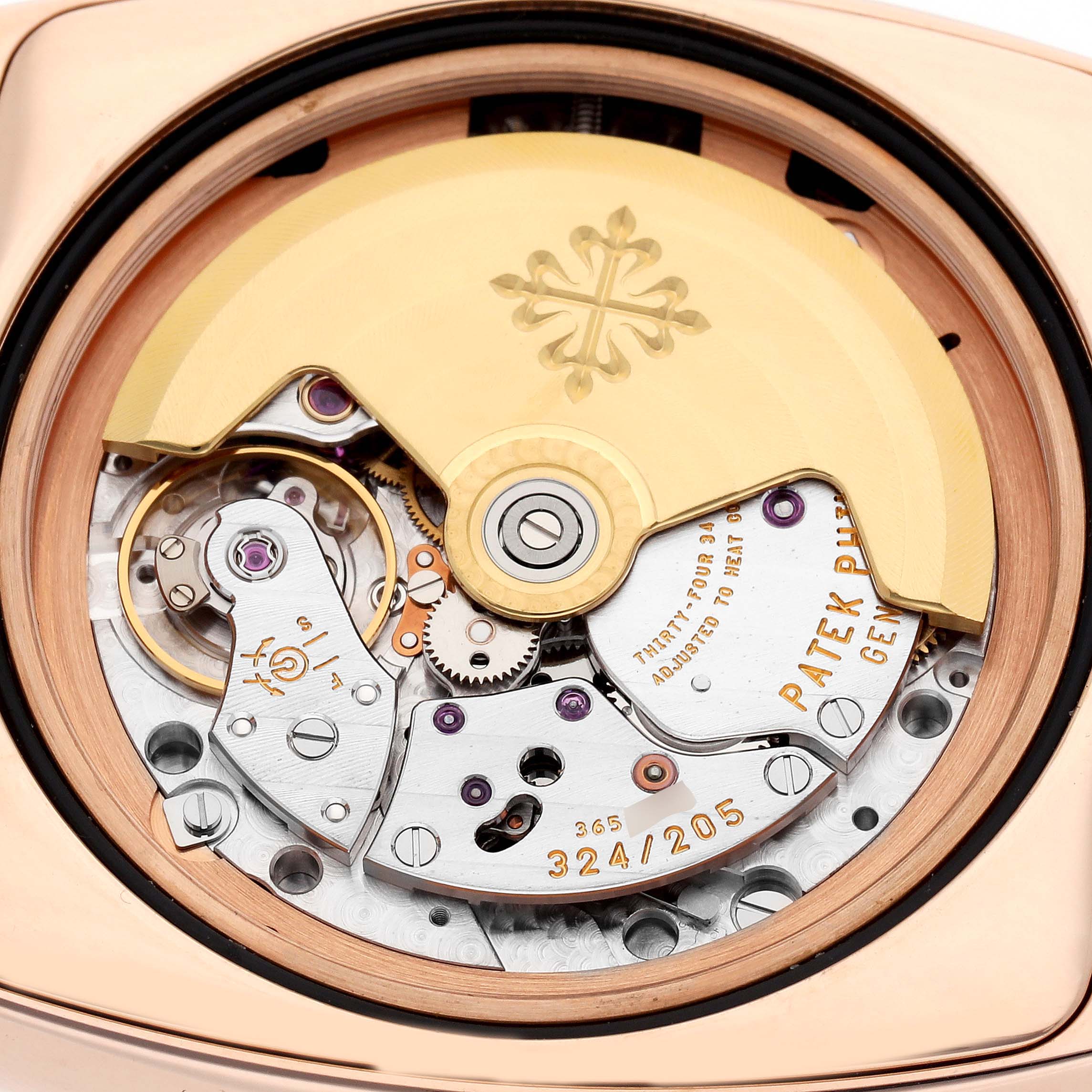 The image shows the movement and rotor of a Patek Philippe Gondolo 5135R Men
s Rose Gold White Dial watch from the back.