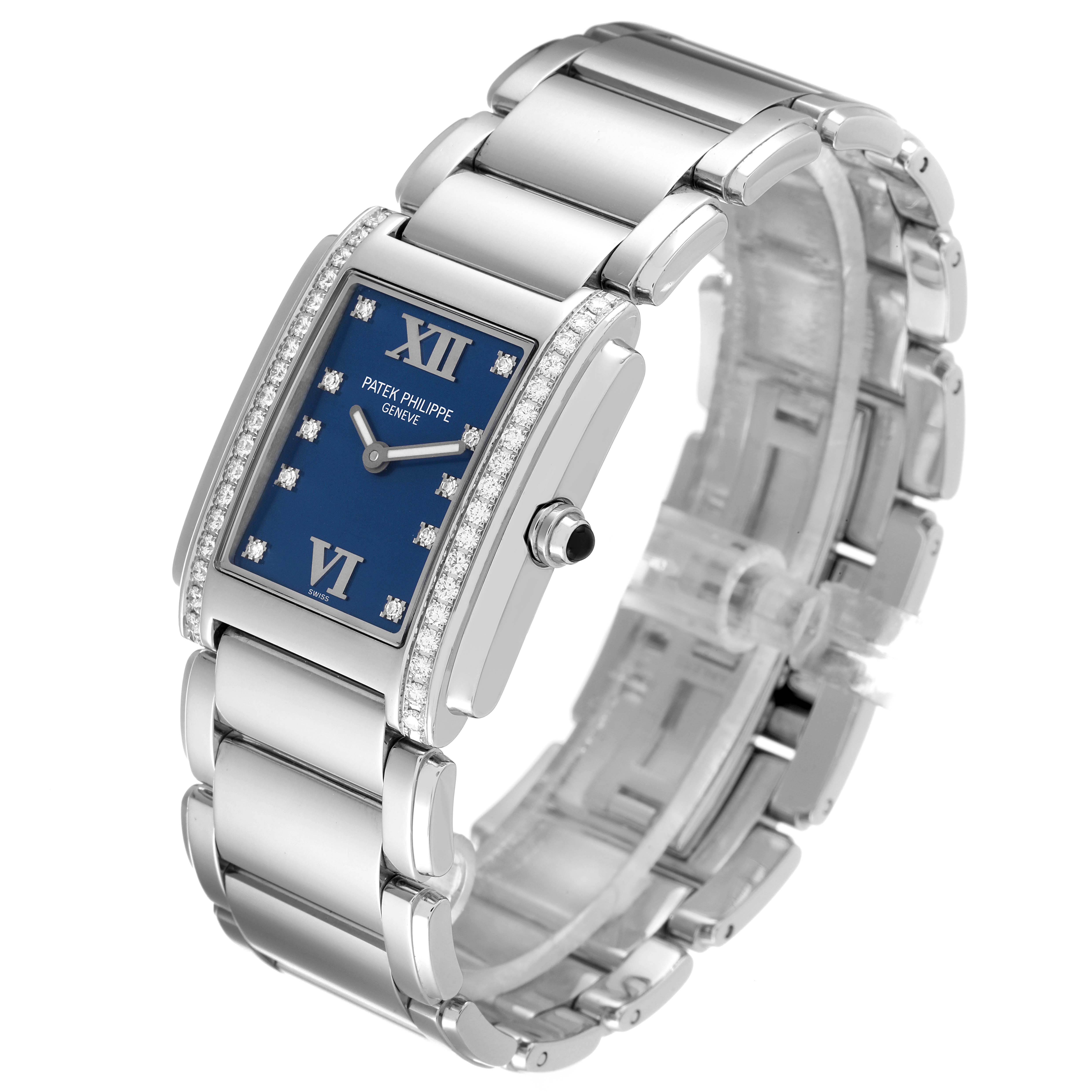 The Patek Philippe Twenty-4 4910-10A-012 Women's Stainless Steel Blue Dial 4910-10A-012 Women's Stainless Steel Blue Dial watch is shown at a three-quarter angle, highlighting its bracelet, rectangular blue dial, and diamond accents.
