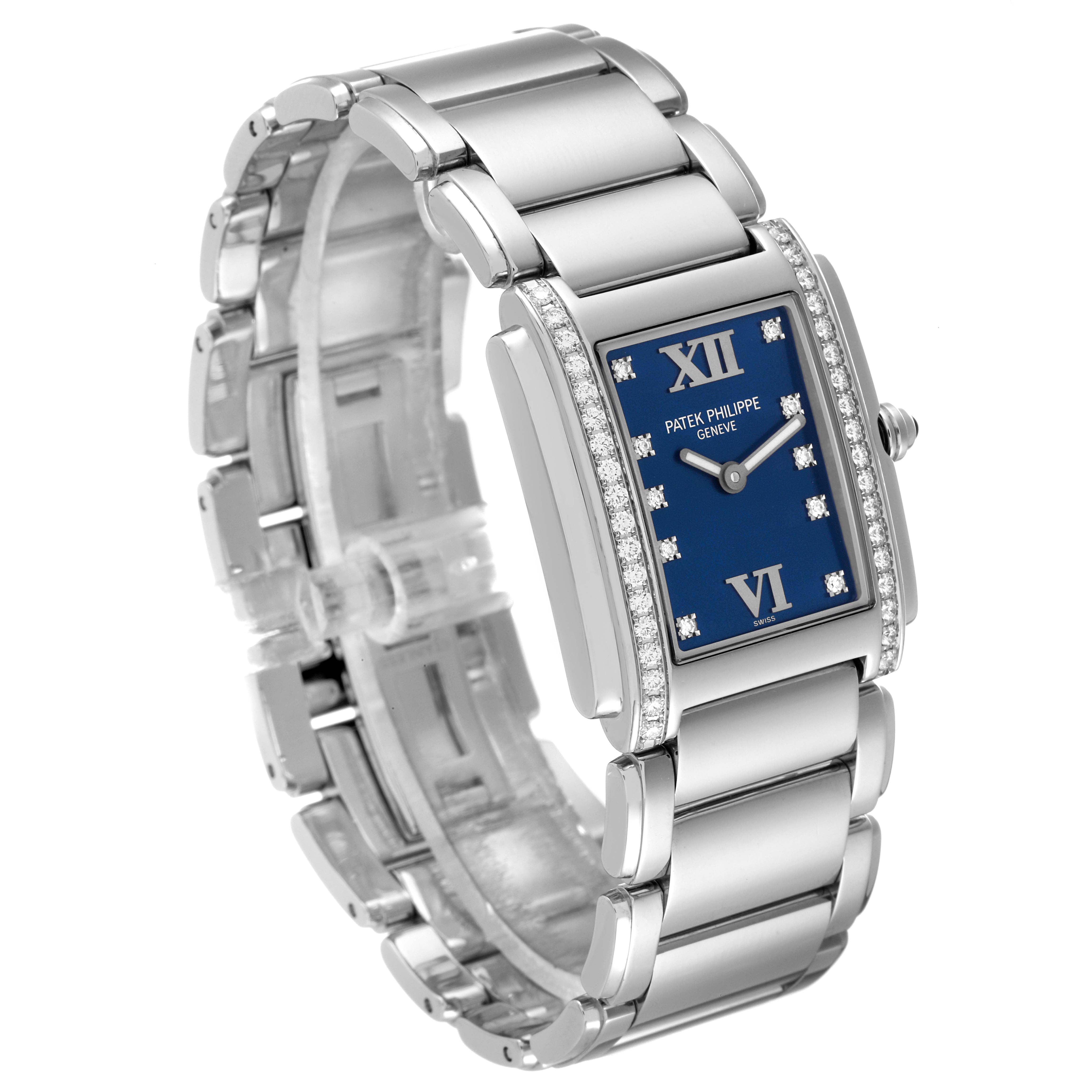 The image shows a Patek Philippe Twenty-4 4910-10A-012 Women's Stainless Steel Blue Dial 4910-10A-012 Women's Stainless Steel Blue Dial watch at an angled side view showcasing its bracelet and face, highlighting the diamond bezel and blue dial.