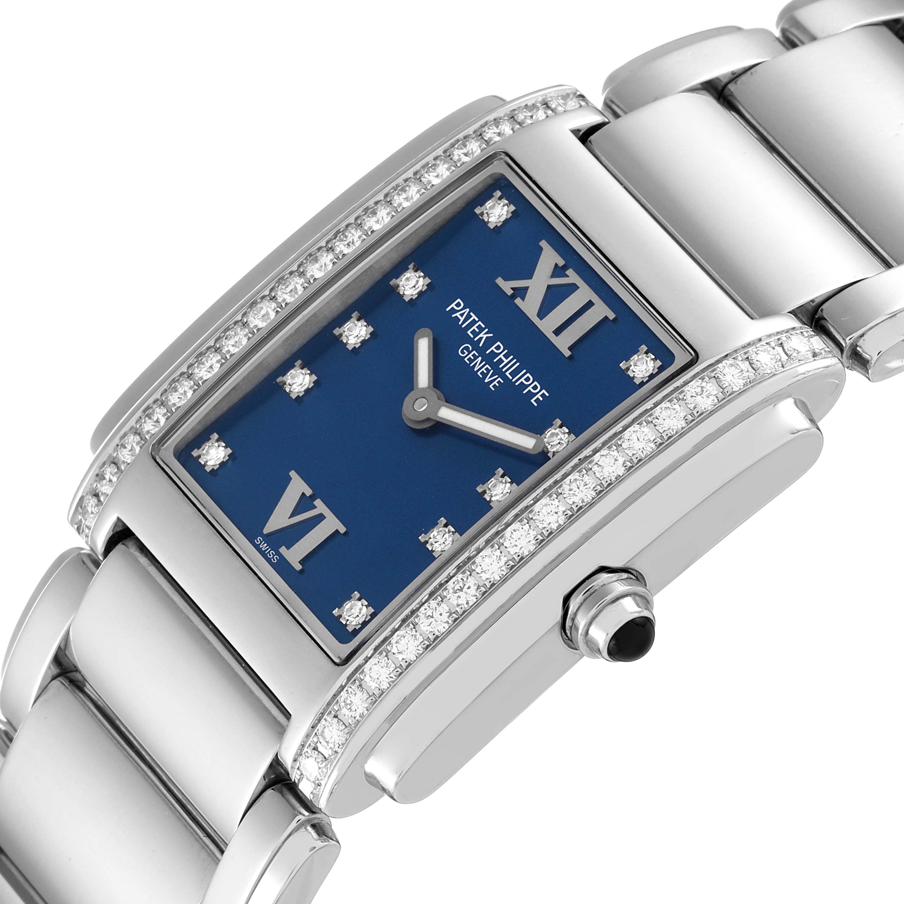 The Patek Philippe Twenty-4 4910-10A-012 Women's Stainless Steel Blue Dial 4910-10A-012 Women's Stainless Steel Blue Dial watch is angled to show its blue dial, diamond bezel, and part of the bracelet.